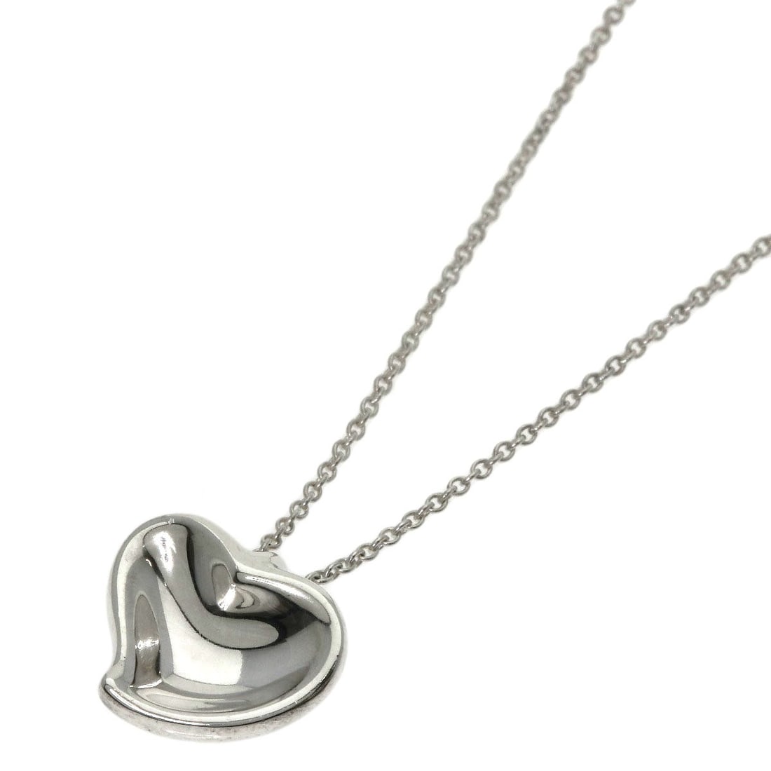 Full Heart Necklace Silver by Tiffany&Co: Full Heart Necklace Silver by Tiffany&Co Silver Full Heart Necklace by Tiffany&Co features a sleek and modern design with a 15.7-inch length, making it a versatile accessory for everyday wear. This st