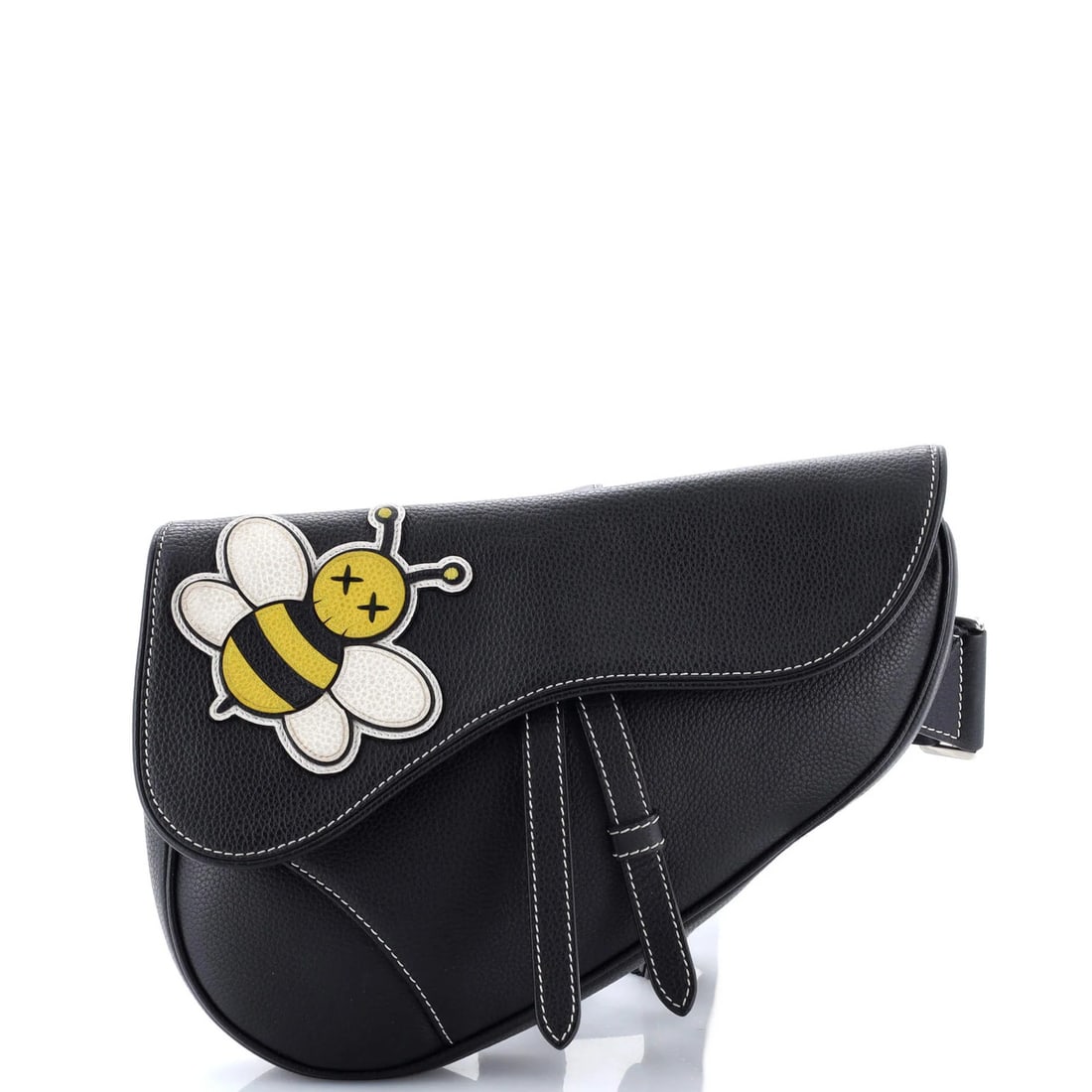 Saddle Crossbody Bag Leather with Christian Dior KAWS Applique: Saddle Crossbody Bag Leather with Christian Dior KAWS Applique The Saddle Crossbody Bag from Christian Dior's KAWS collaboration boasts a sleek black leather exterior adorned with an eye-catching appl