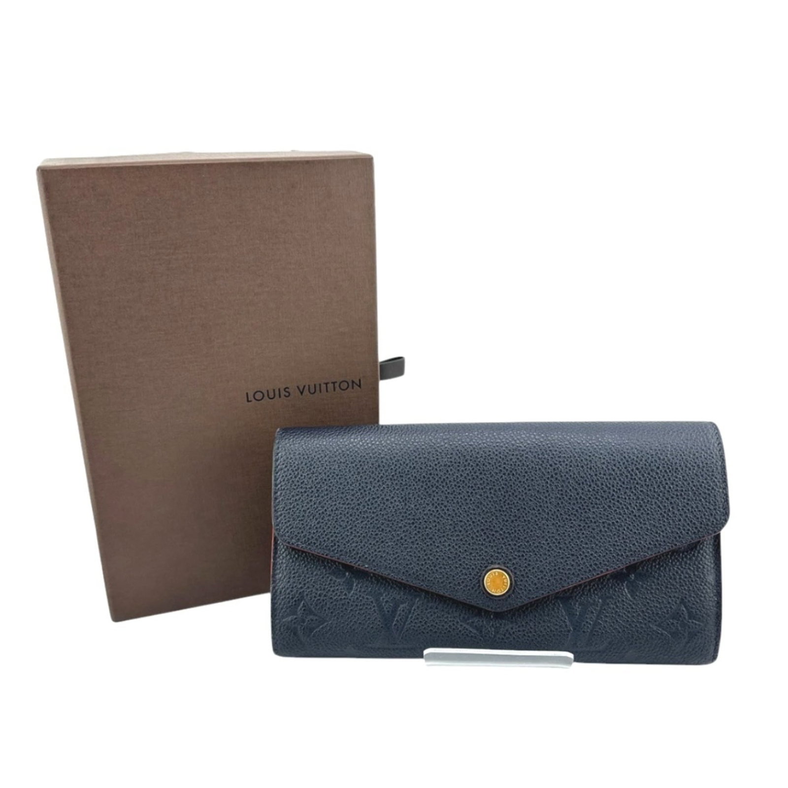 Bi Fold Monogram Empreinte Wallet Louis Vuitton: Bi Fold Monogram Empreinte Wallet Louis Vuitton Marine rouge Monogram Empreinte wallet from Louis Vuitton, featuring a bi-fold design and dust bag. This long wallet measures 10cm x 19cm x 3cm and is
