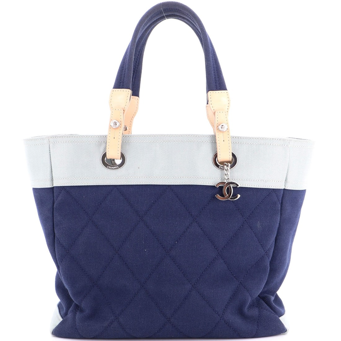 Quilted Canvas Large Tote Biarritz Chanel: Quilted Canvas Large Tote Biarritz Chanel Canvas Plain Quilted Large Tote in Blue, Model Biarritz, with Satin Interior and Silver Hardware. This Quilted Canvas Large Tote features a blue exterior with