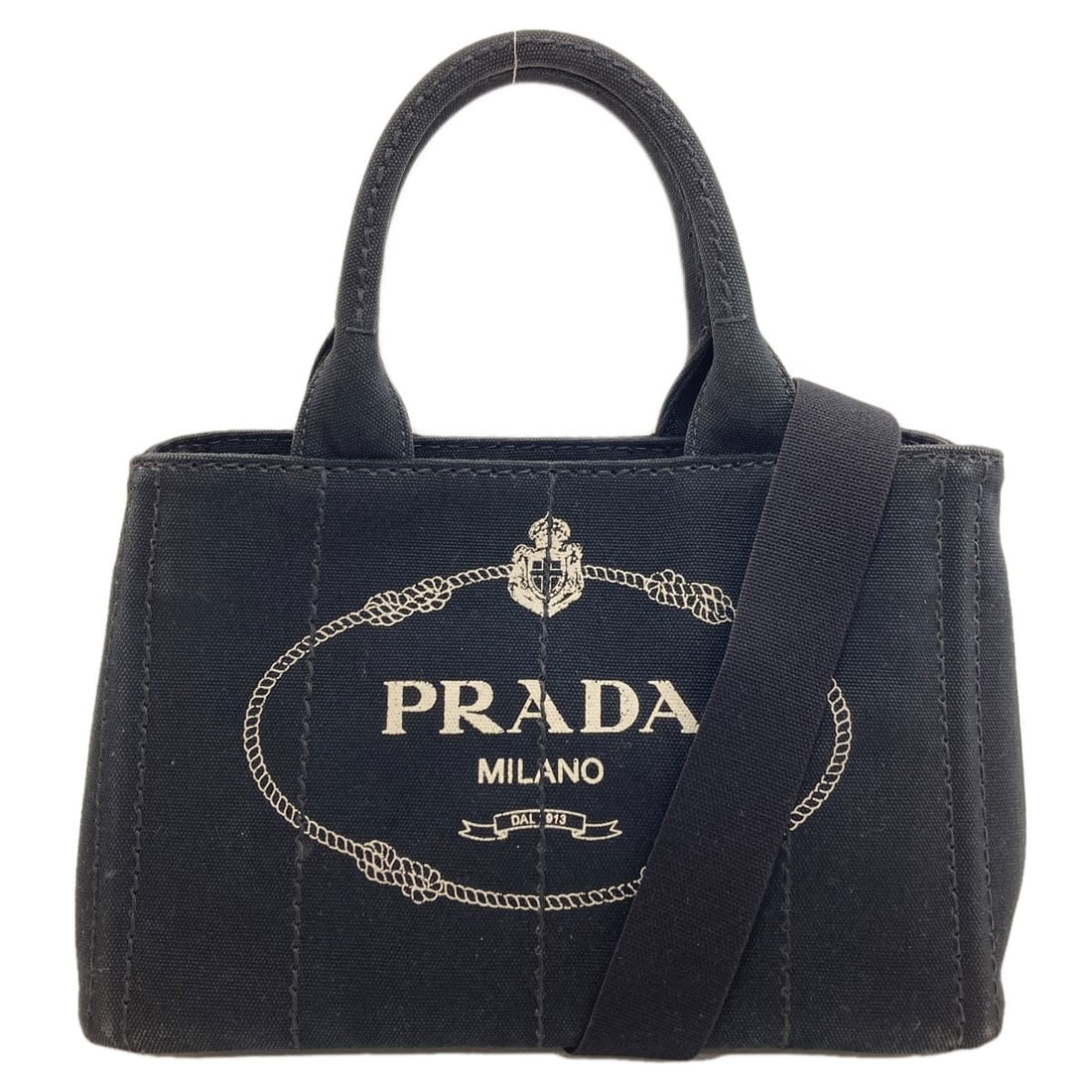 Prada 1Bg439 Canapa Mini 2 Way Handbag Canvas: Prada 1Bg439 Canapa Mini 2 Way Handbag Canvas The Prada 1Bg439 Canapa Mini 2 Way Handbag Canvas is a sleek and understated black canvas handbag with a 2-way design, allowing for versatility in its use