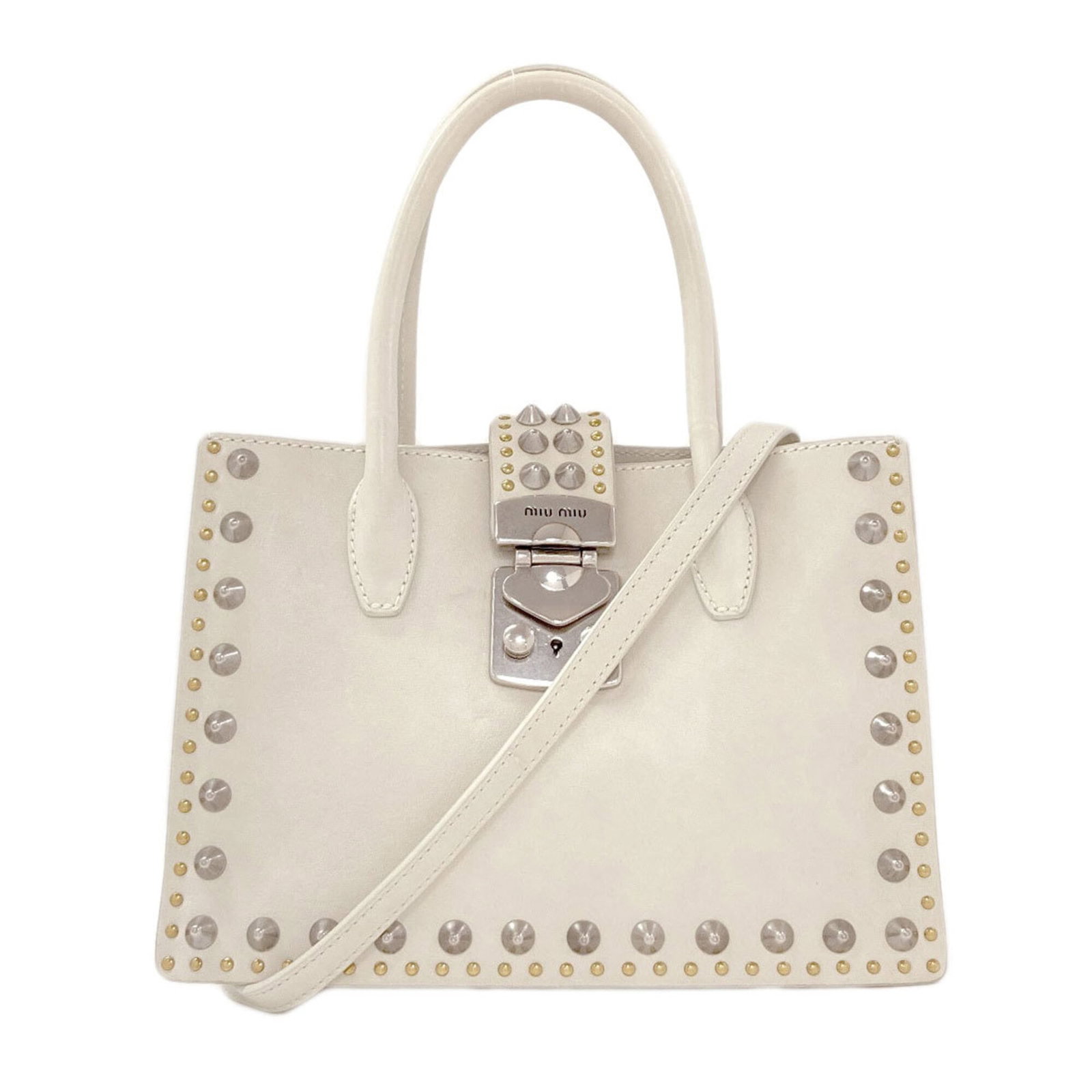 Handbag Miu Leather: Handbag Miu Leather The Miu Miu Handbag is crafted from high-quality Calfskin leather, featuring a sleek white finish. With its sturdy 30cm handle and adjustable strap length, this stylish bag is