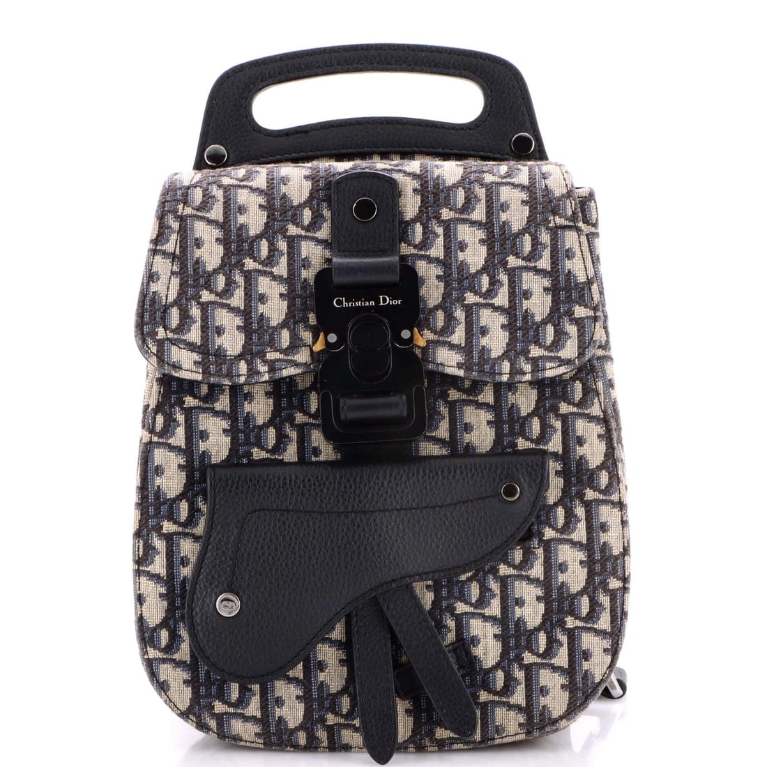 Mini Oblique Canvas Saddle Backpack Dior Christian: Mini Oblique Canvas Saddle Backpack Dior Christian Mini Oblique Canvas Saddle Backpack Dior Christian is a stylish and compact backpack featuring a striking blue oblique canvas exterior. With a classi