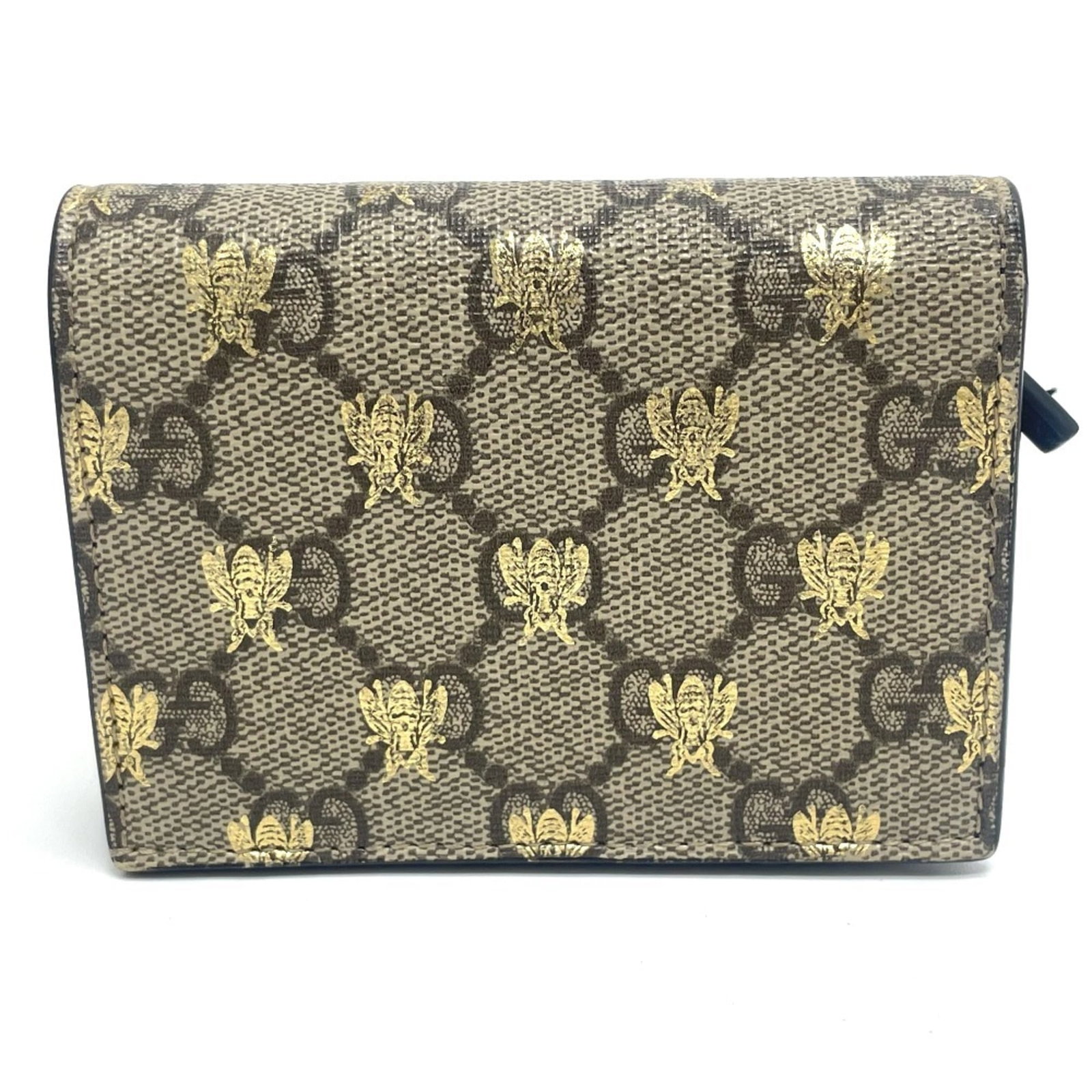 Gg Supreme Gg Bi Fold Wallet: Gg Supreme Gg Bi Fold Wallet The Gucci GG Supreme bi-fold wallet boasts a sleek, beige design with a classic GG Supreme pattern. Measuring 8.4cm x 10.5cm x 2.5cm, this wallet comes with a luxurious