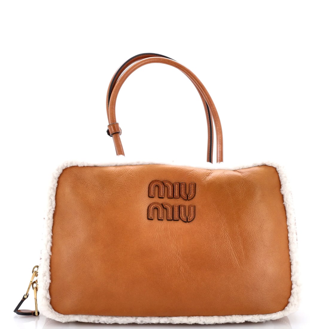Top Handle Leather Bag Large Miu: Top Handle Leather Bag Large Miu Large Miu Miu Top Handle Bag in Brown Leather. This spacious bag features a classic top handle design, measuring 7" in height, 14" in width, and 3" in depth. With its