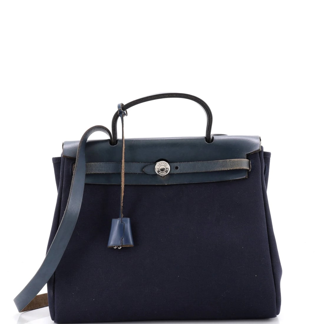 Herbag Toile Hermes Leather PM: Herbag Toile Hermes Leather PM Blue Herm?s Leather PM Toile Bag with Palladium Hardware, featuring a classic top handle design and a canvas interior. The bag's exterior leather has developed heavy