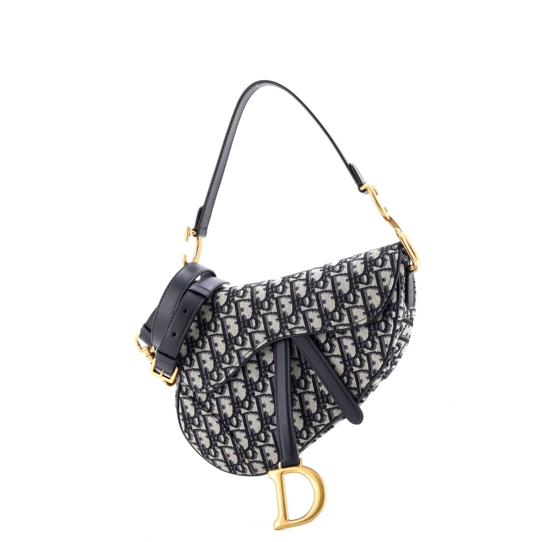 Saddle Handbag Strap Oblique Canvas Medium Christian Dior: Saddle Handbag Strap Oblique Canvas Medium Christian Dior Saddle Handbag with Strap Oblique Canvas Medium in Blue. This Christian Dior shoulder bag features a striking oblique canvas design and a