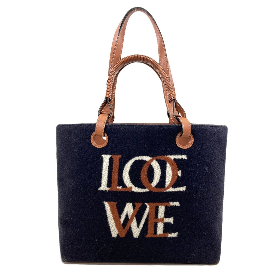 Loewe Love Anagram 2Way Tote Bag Wool: Loewe Love Anagram 2Way Tote Bag Wool Navy wool tote bag from LOEWE, featuring a 2-way design. The bag's exterior is made from high-quality wool, providing a unique and textured look. This stylish