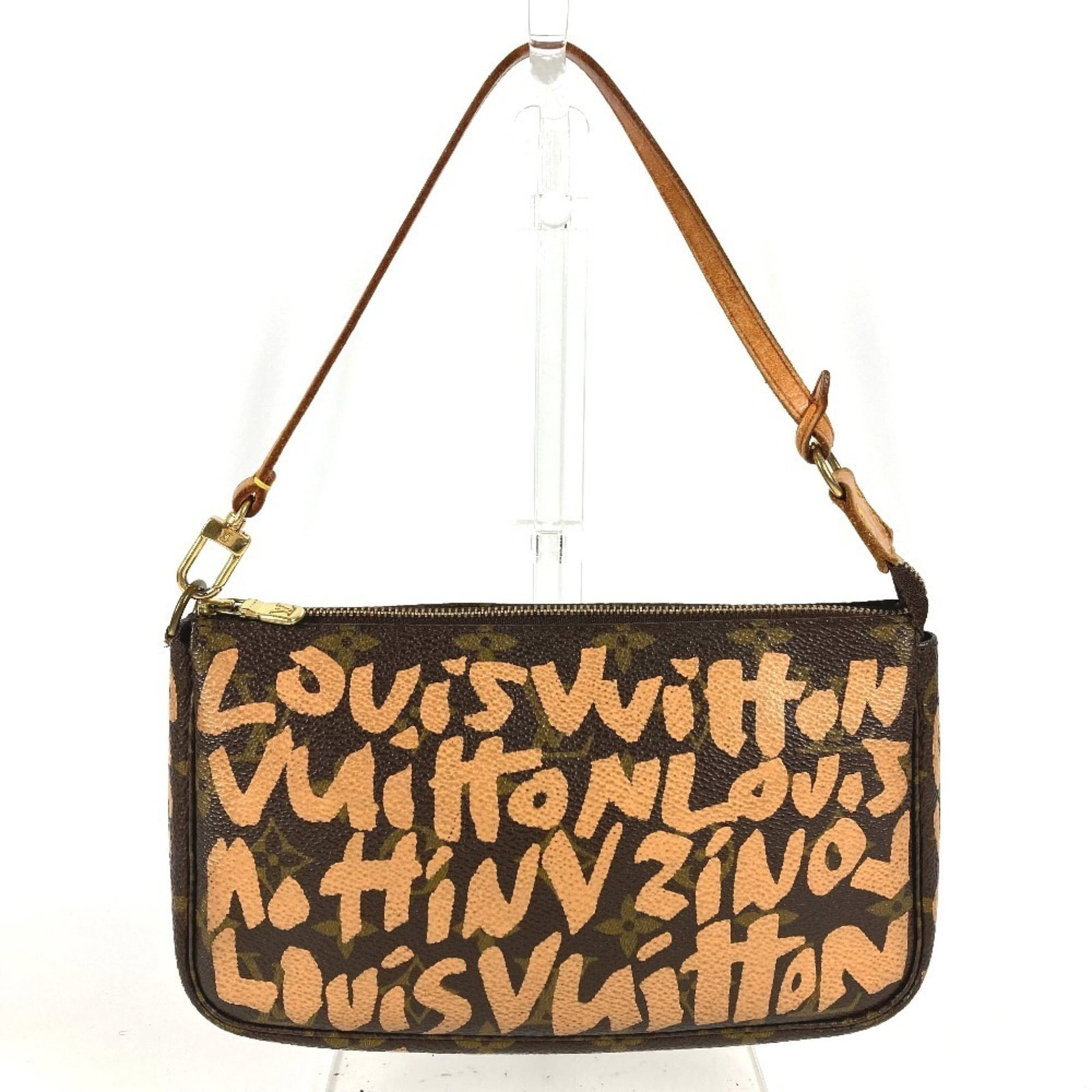 Louis Vuitton Handbag Pochette Shoulder Bag Monogram Graffiti: Louis Vuitton Handbag Pochette Shoulder Bag Monogram Graffiti The Louis Vuitton Monogram Graffiti Pochette Shoulder Bag boasts a unique, eye-catching design with its signature Monogram Graffiti patter