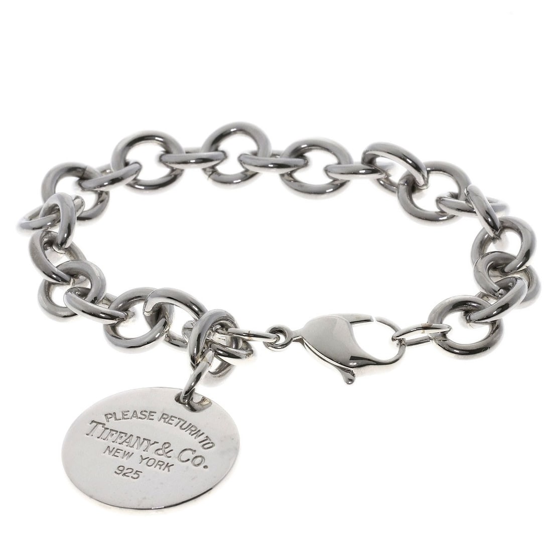 Return to Tiffany Round Silver Bracelet: Return to Tiffany Round Silver Bracelet Silver Round Bracelet from Tiffany&Co. features a sleek, silver design with no stone. This classic bracelet is made from high-quality silver metal, adding a