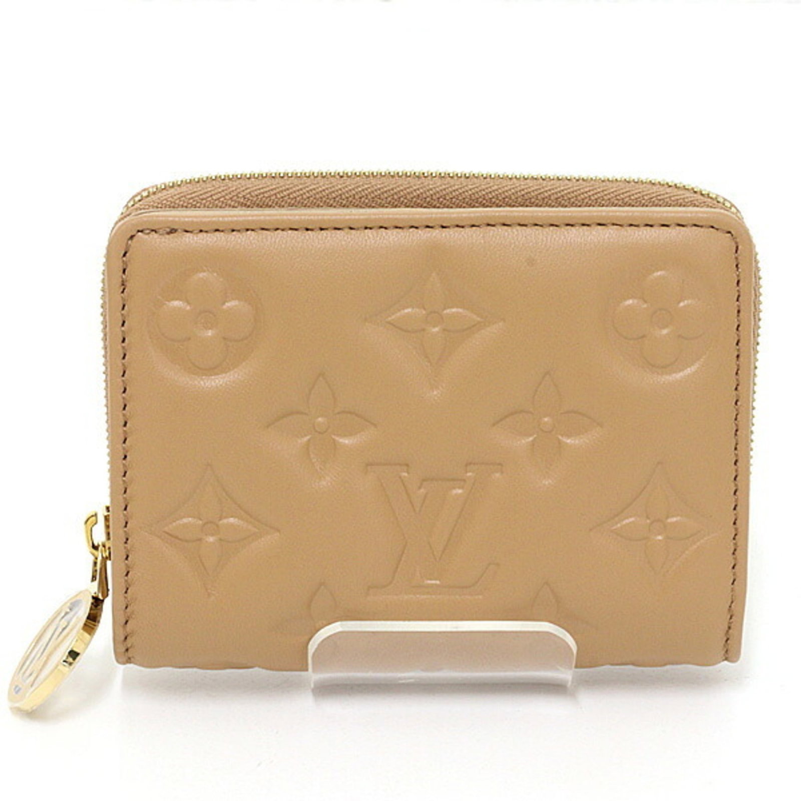 Louis Vuitton Wallet (Bi-Fold) Leather: Louis Vuitton Wallet (Bi-Fold) Leather Luxurious camel-colored leather, expertly crafted into a classic bi-fold wallet by Louis Vuitton, France's renowned luxury brand. This stylish accessory boasts