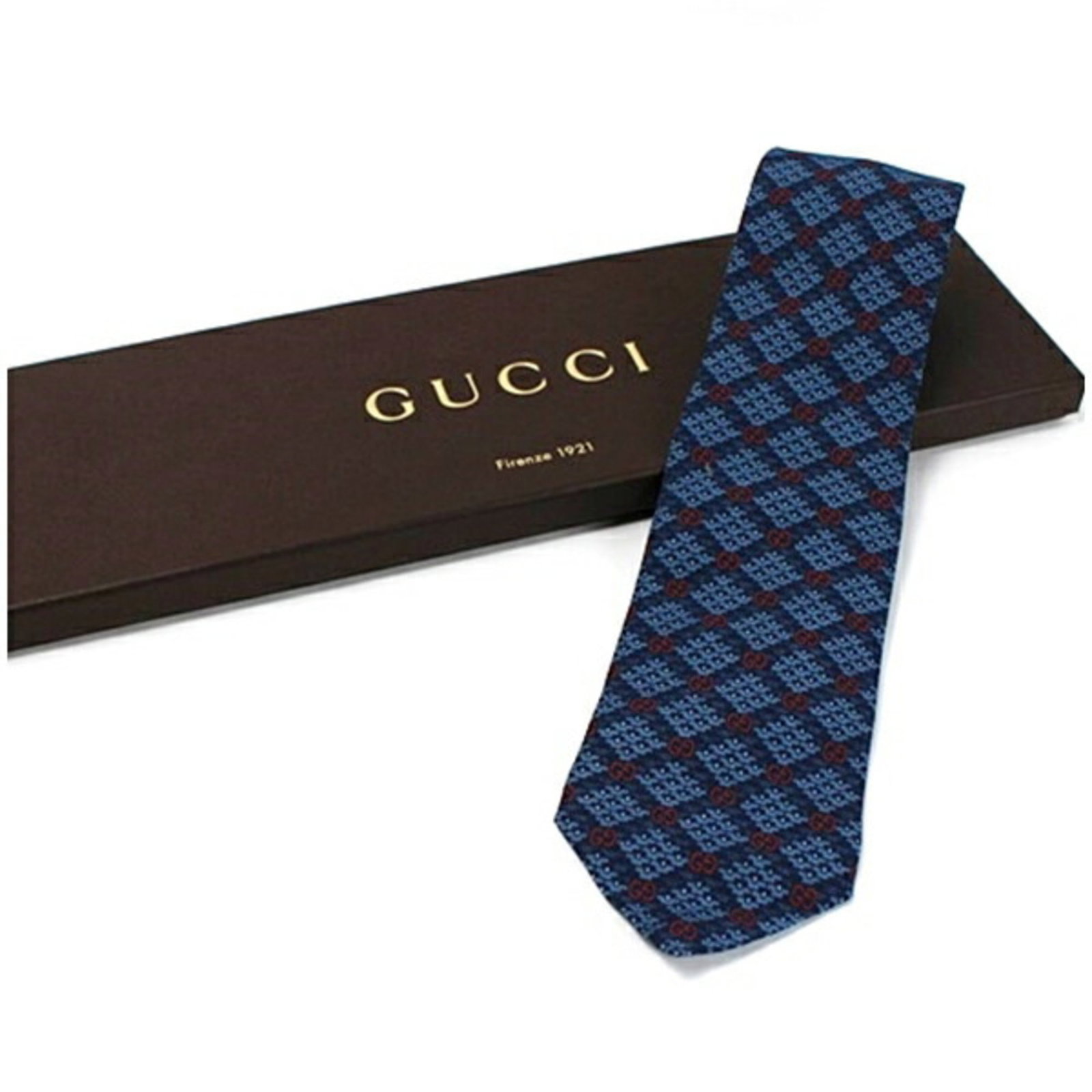Gucci Rayon Cravat: Gucci Rayon Cravat Rayon cravat in blue, navy, or red, with a width of 8cm / 3.14'', presented in a box. This Gucci accessory features a stylish design made from rayon material. A stylish addition to