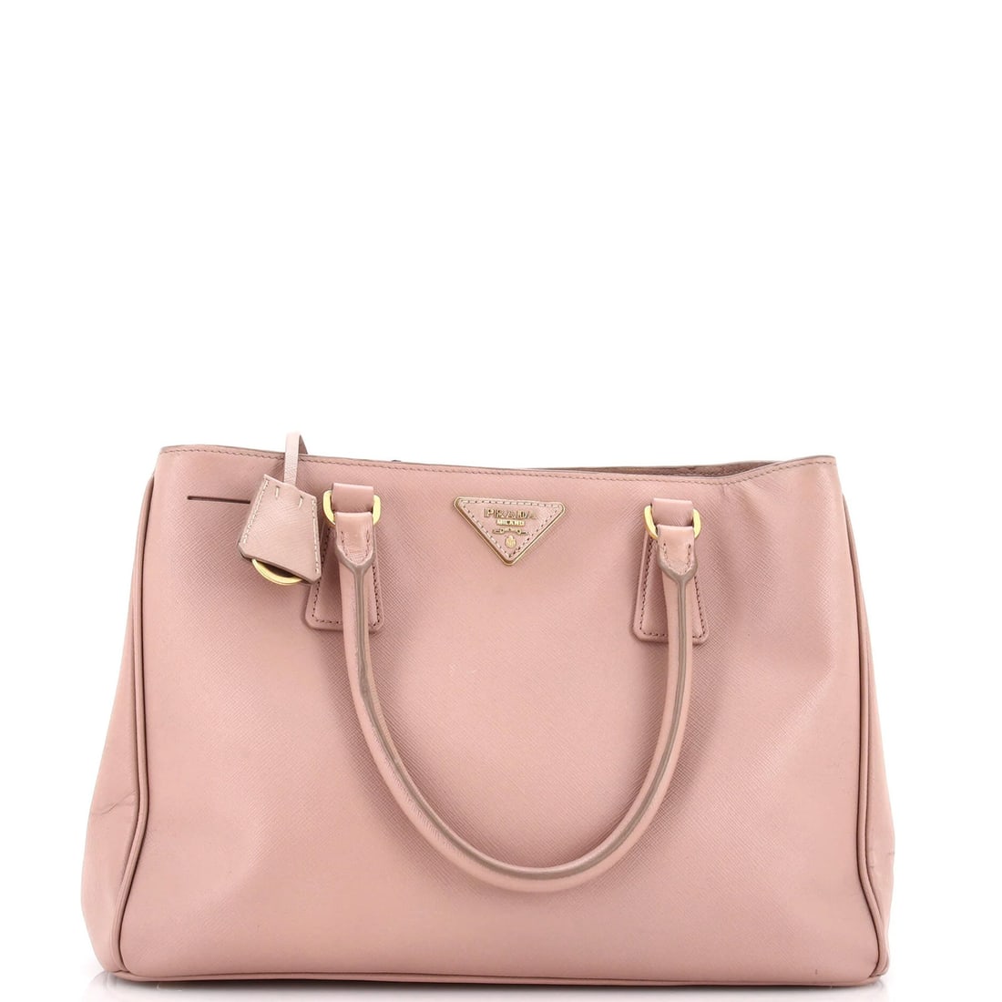 Saffiano Leather Large Prada Gardener's Tote: Saffiano Leather Large Prada Gardener's Tote Saffiano Leather Large Prada Gardener's Tote features a neutral exterior with scuffs, cracking, and edge wear, and a gold clochette. The tote measures