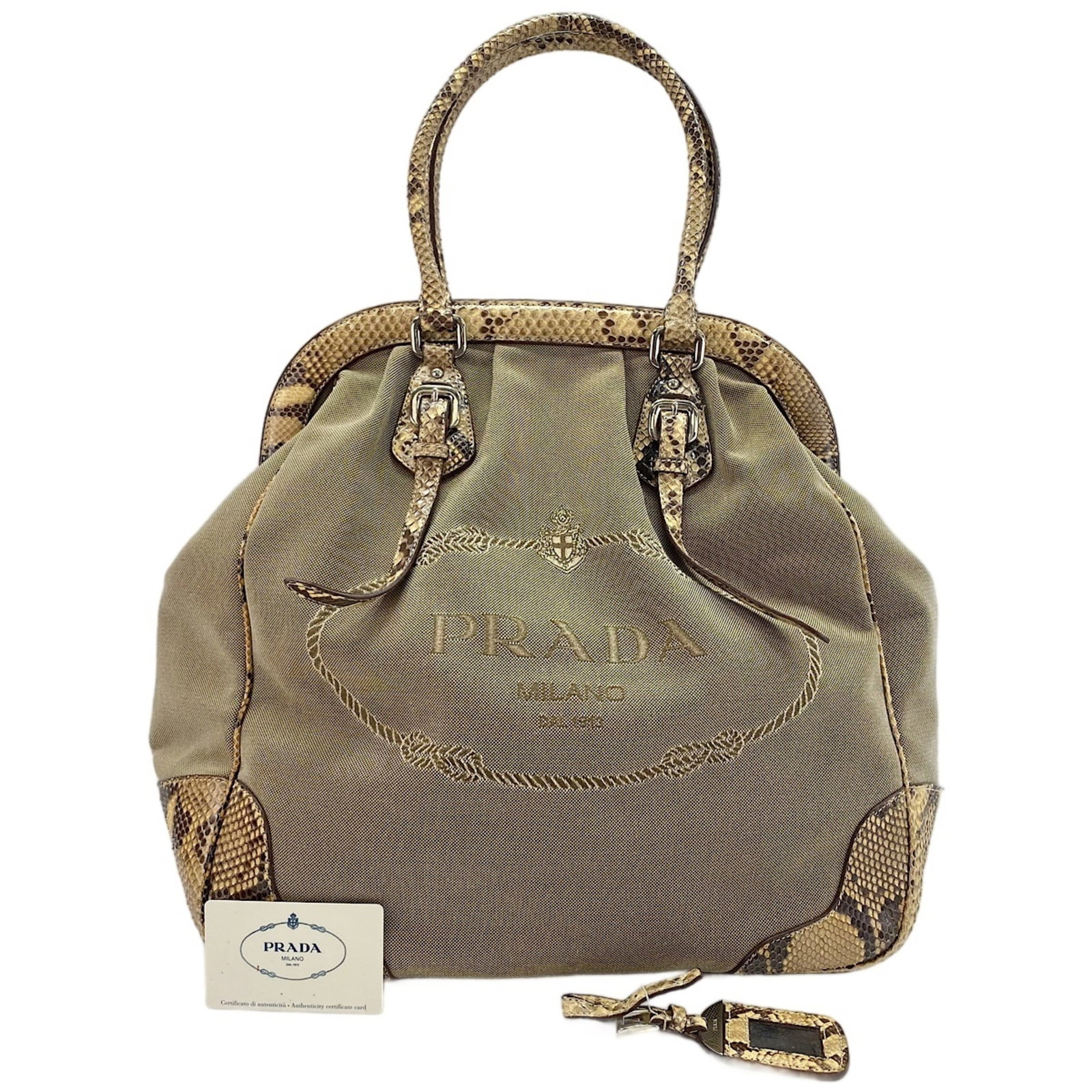 Handbag Prada: Handbag Prada This Prada handbag is crafted from high-quality materials and features a timeless beige color. Measuring 38cm x 35cm x 16cm, it offers a spacious interior and sleek design. With its
