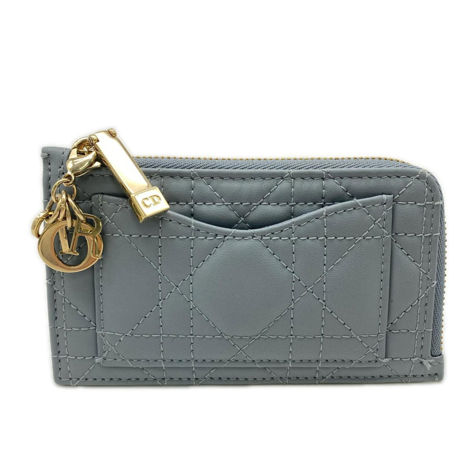 Card Case Leather By Dior: Card Case Leather By Dior The Card Case Leather By Dior is a stylish and compact accessory made from lambskin leather, featuring a sleek blue color and a secure zipper closure. With dimensions of 7cm