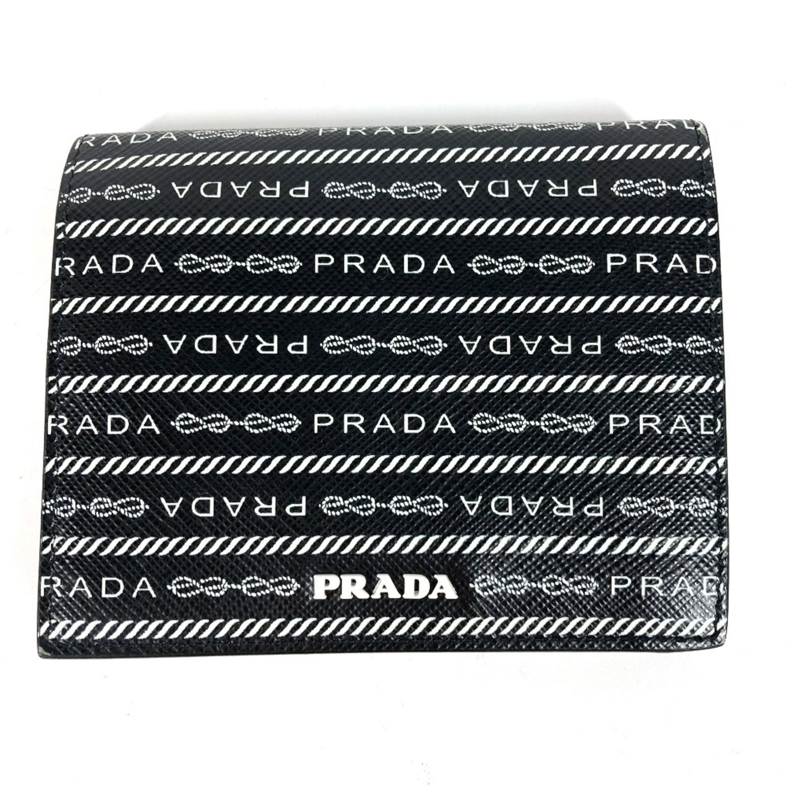 Bi fold leather wallet: Bi fold leather wallet Bi-fold leather wallet in black and white, measuring 9cm x 11cm, comes with a box. Item Specifics: Brand: Prada MPN: 1MV204 Type: Wallet (bi-fold) Gender: Men,Women Material: