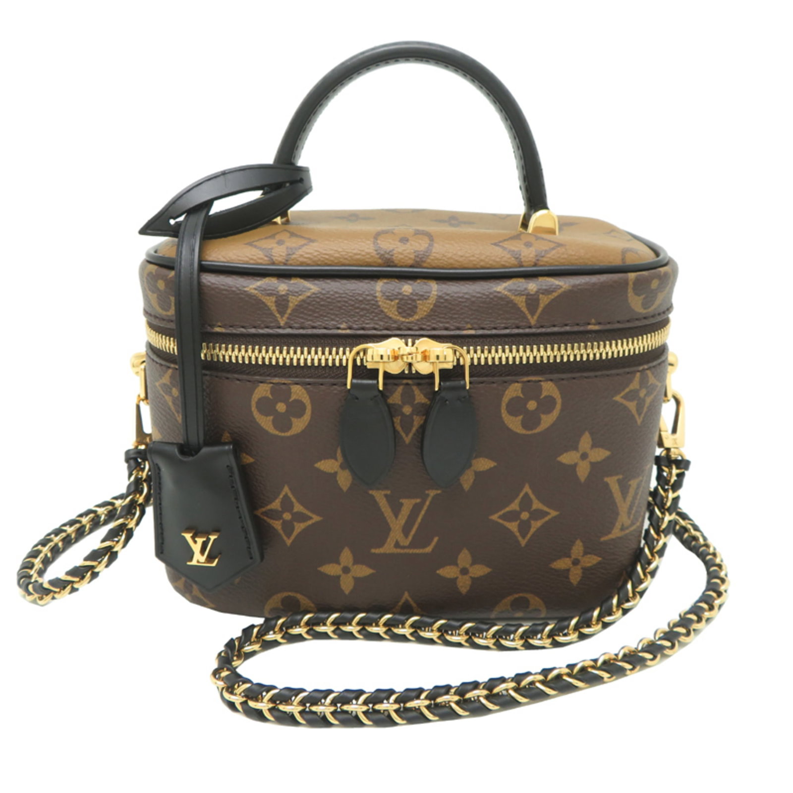 Monogram Reverse Handbag Vuitton Louis: Monogram Reverse Handbag Vuitton Louis Monogram Reverse Louis Vuitton Handbag in Brown. This Louis Vuitton handbag features the iconic Monogram Reverse pattern in a rich brown color. With its compact