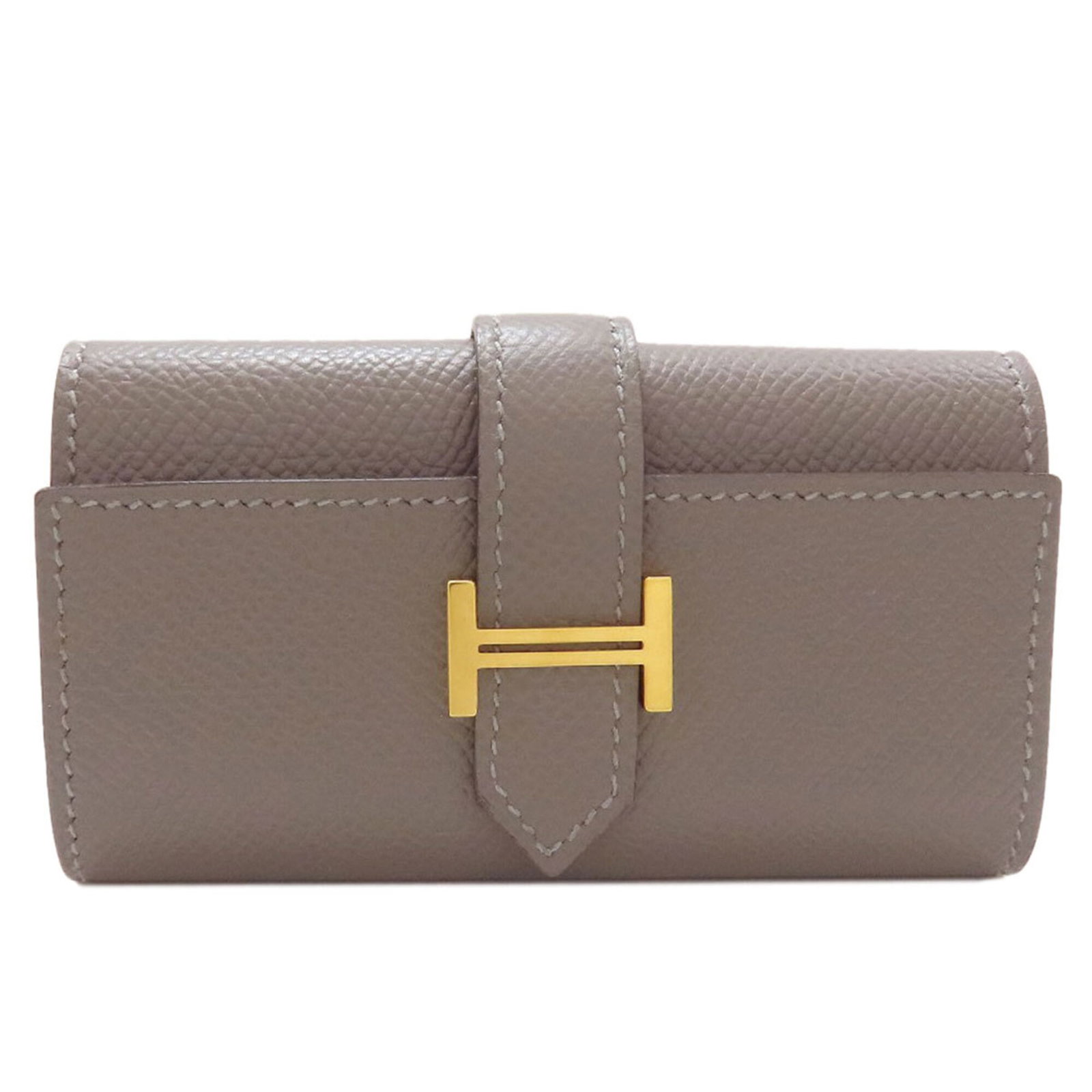 Epsom Leather Keycase Hermes: Epsom Leather Keycase Hermes Epsom Leather Keycase by Hermes boasts a sleek, gray design with four key hooks, perfect for keeping your essentials organized. Made from high-quality Epsom leather, this