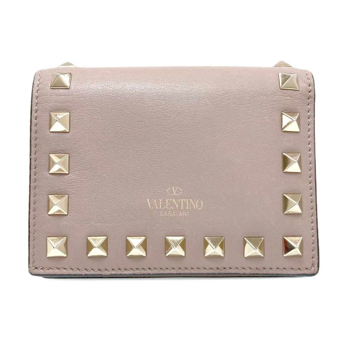 Valentino Rock Studs Bifold Wallet With Coin Pocket Leather: Valentino Rock Studs Bifold Wallet With Coin Pocket Leather Valentino's Rock Studs Bifold Wallet with Coin Pocket Leather boasts a sleek, beige design with a subtle touch of edginess from the iconic