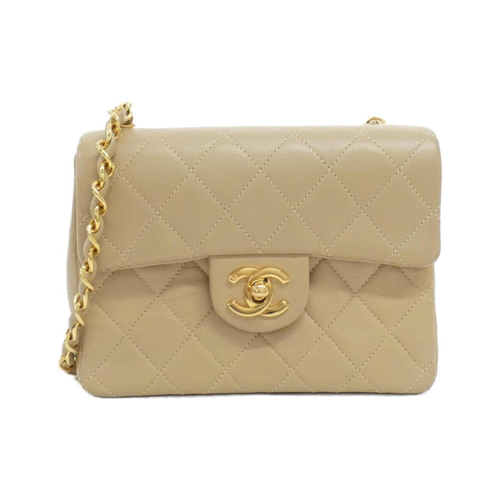 Shoulder Bag Leather Chanel: Shoulder Bag Leather Chanel This luxurious shoulder bag is crafted from high-quality lamb leather, featuring a classic Chanel design. The timeless beige color and gold hardware add a touch of sophisti