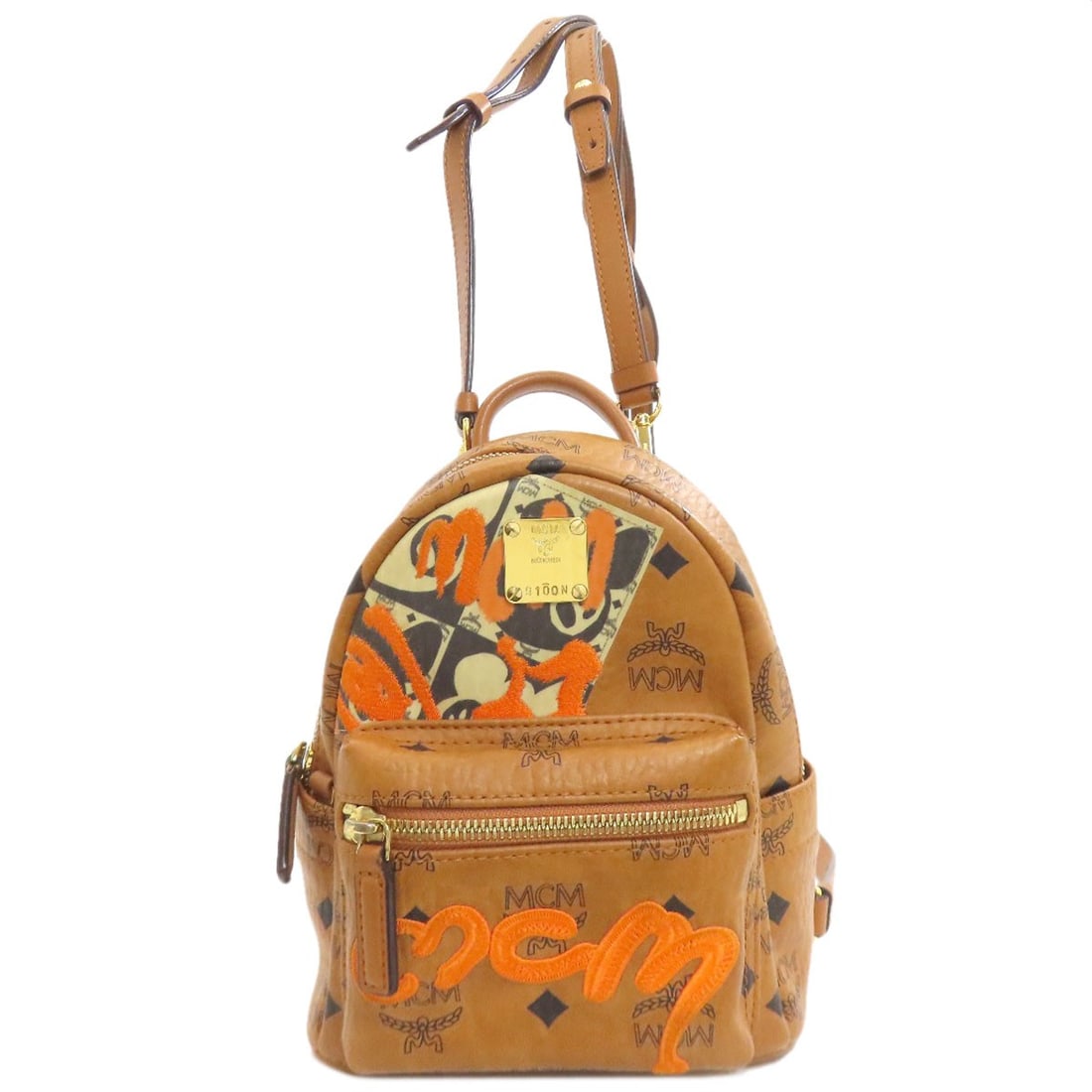 Logo Backpack Pvc Daypack Mcm: Logo Backpack Pvc Daypack Mcm Brown MCM Style PVC Daypack Backpack A* with a classic design, featuring a durable PVC exterior and a signature logo on the front. This iconic daypack is a staple of the