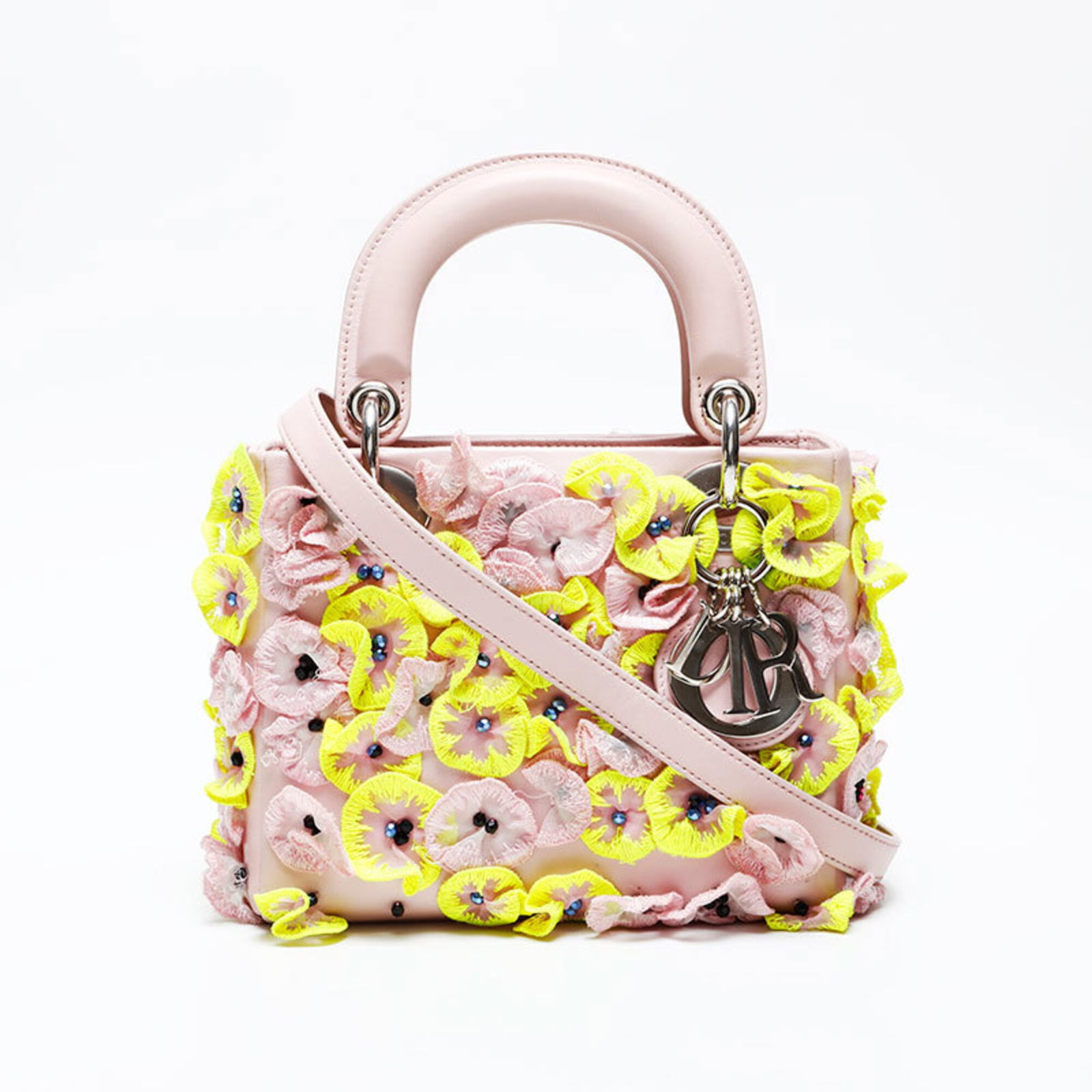 Shoulder Bag by Christian Dior: Shoulder Bag by Christian Dior Pink shoulder bag by Christian Dior, measuring 13.5cm x 17.5cm x 7cm, features a signature from the renowned Italian luxury brand. This stylish bag boasts a compact