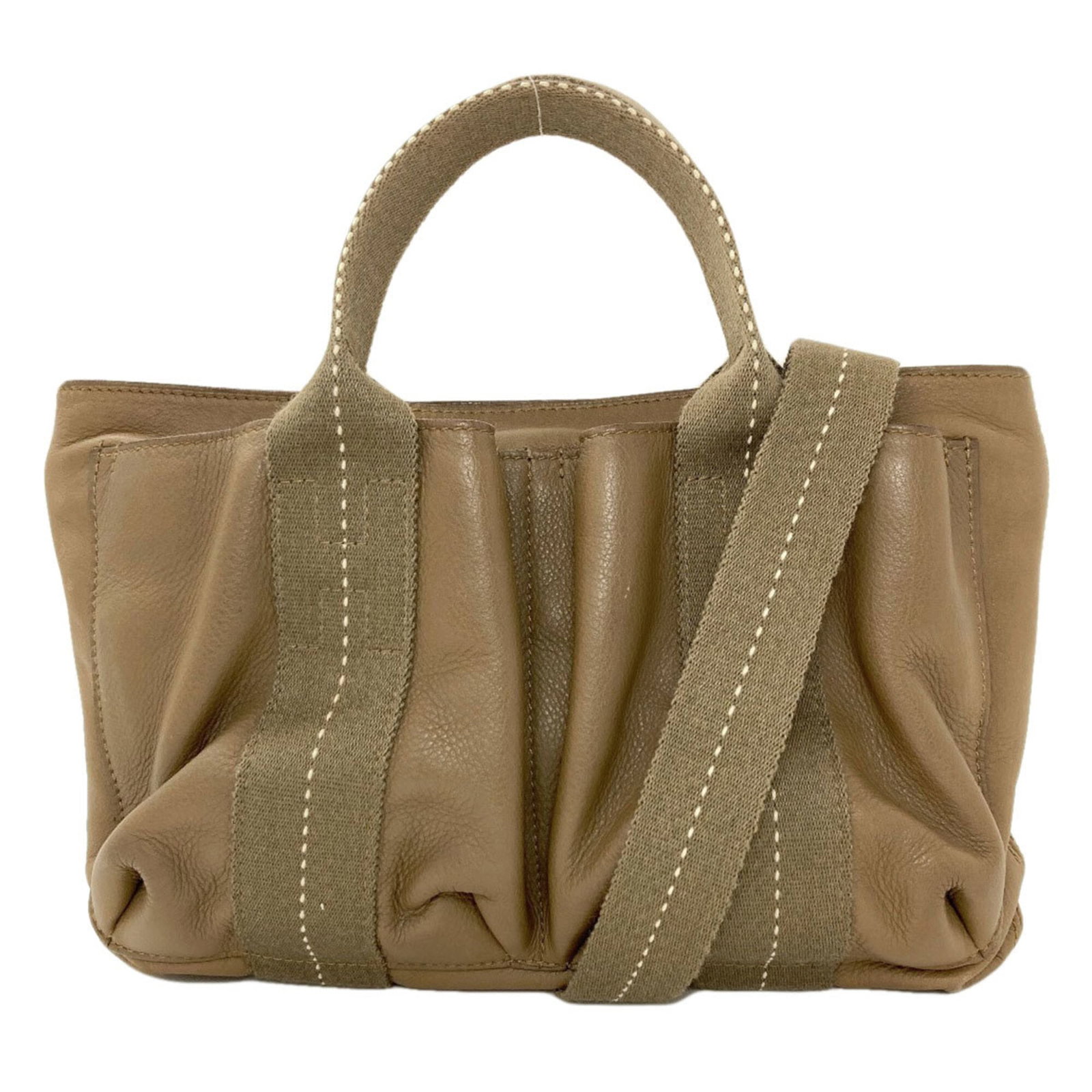 Canvas Veau Hermes Handbag: Canvas Veau Hermes Handbag Canvas Veau Hermes Handbag features a unique canvas and Veau Derma material, showcasing a khaki color. The handbag's horizontal design and zipper closure add to its distinct