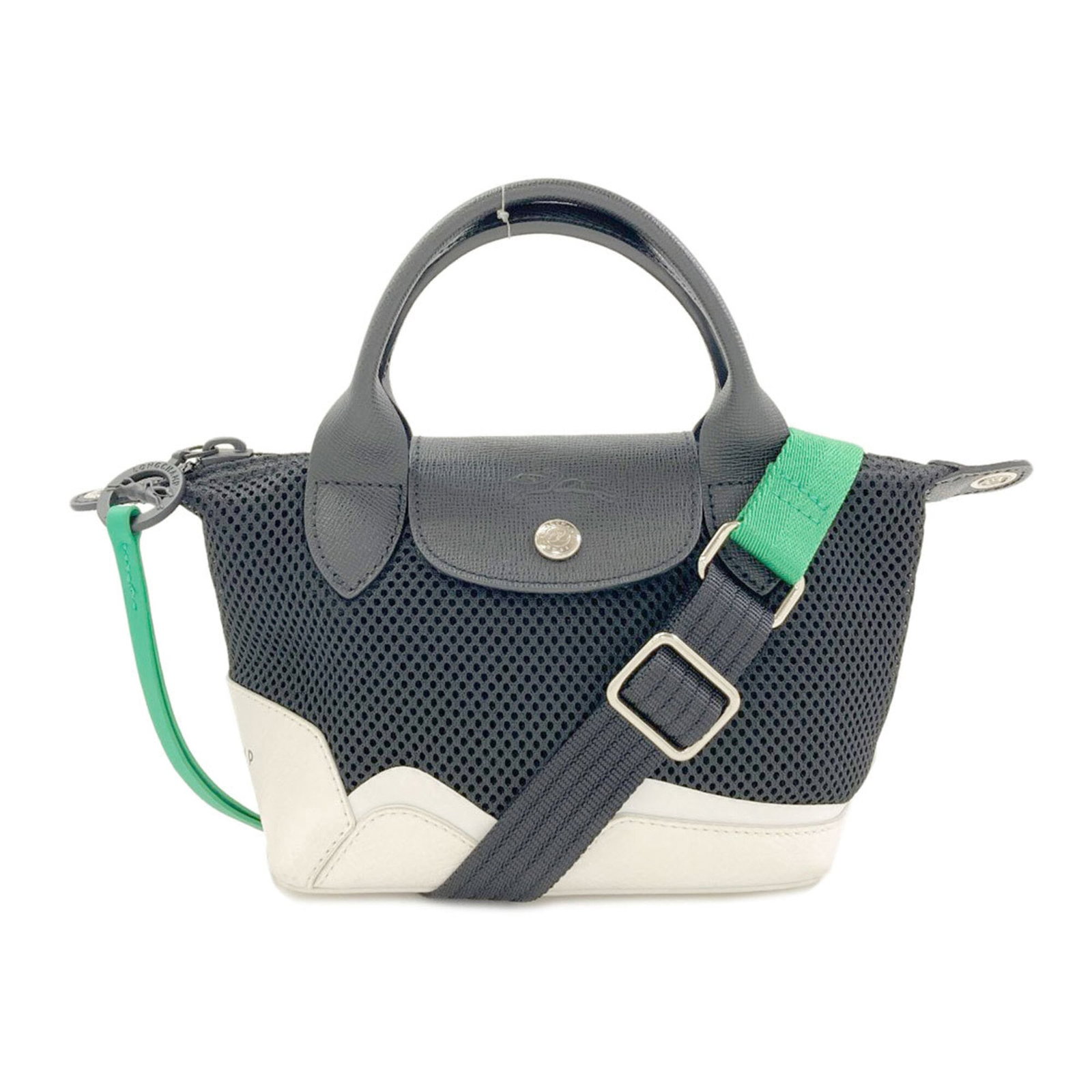Polyester Handbag Longchamp: Polyester Handbag Longchamp Black and White Polyester Longchamp Handbag. Made from polyester, this 15.5cm x 17cm x 10cm handbag features a classic design with a timeless black and white color