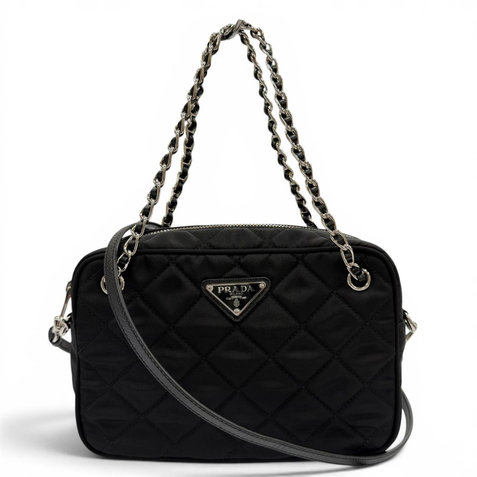 Prada Handbag Shoulder Bag Leather: Prada Handbag Shoulder Bag Leather Prada Handbag Shoulder Bag Leather in Black features a sleek design with a silver hardware accent, making it a stylish accessory for women. The bag measures 14cm x 2