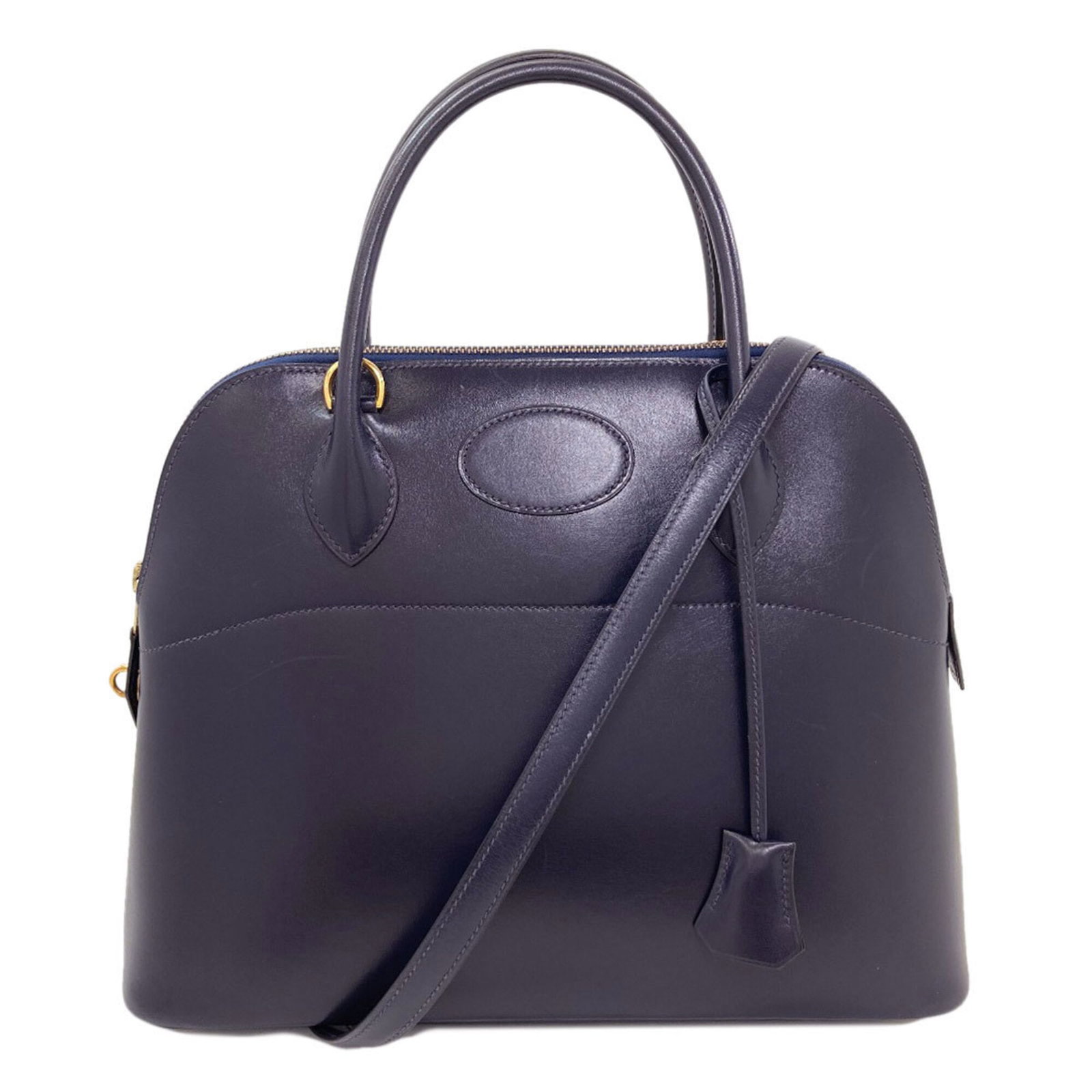 Calf Leather Handbag Box Hermes: Calf Leather Handbag Box Hermes Box calf leather construction provides a rich, subtle texture to this Dark Blue Hermes handbag. Measuring 25cm x 31cm x 12cm, its compact size belies its elegant design