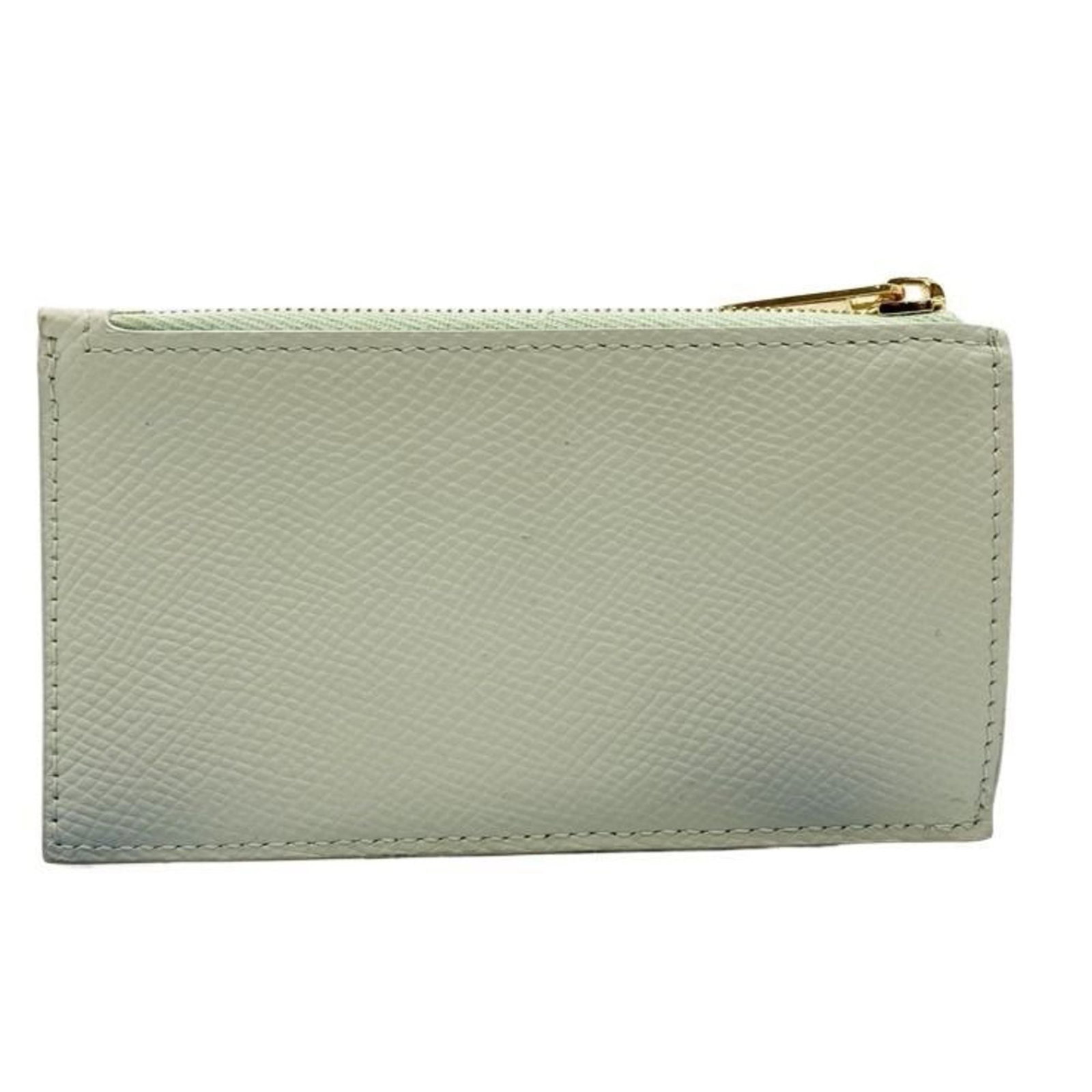 Celine Coin Purse/ Coin Case Leather: Celine Coin Purse/ Coin Case Leather The Celine Coin Purse/ Coin Case Leather is a stylish and compact leather accessory, measuring 13cm x 7.5cm x 1.2cm, featuring a light green color. Made from