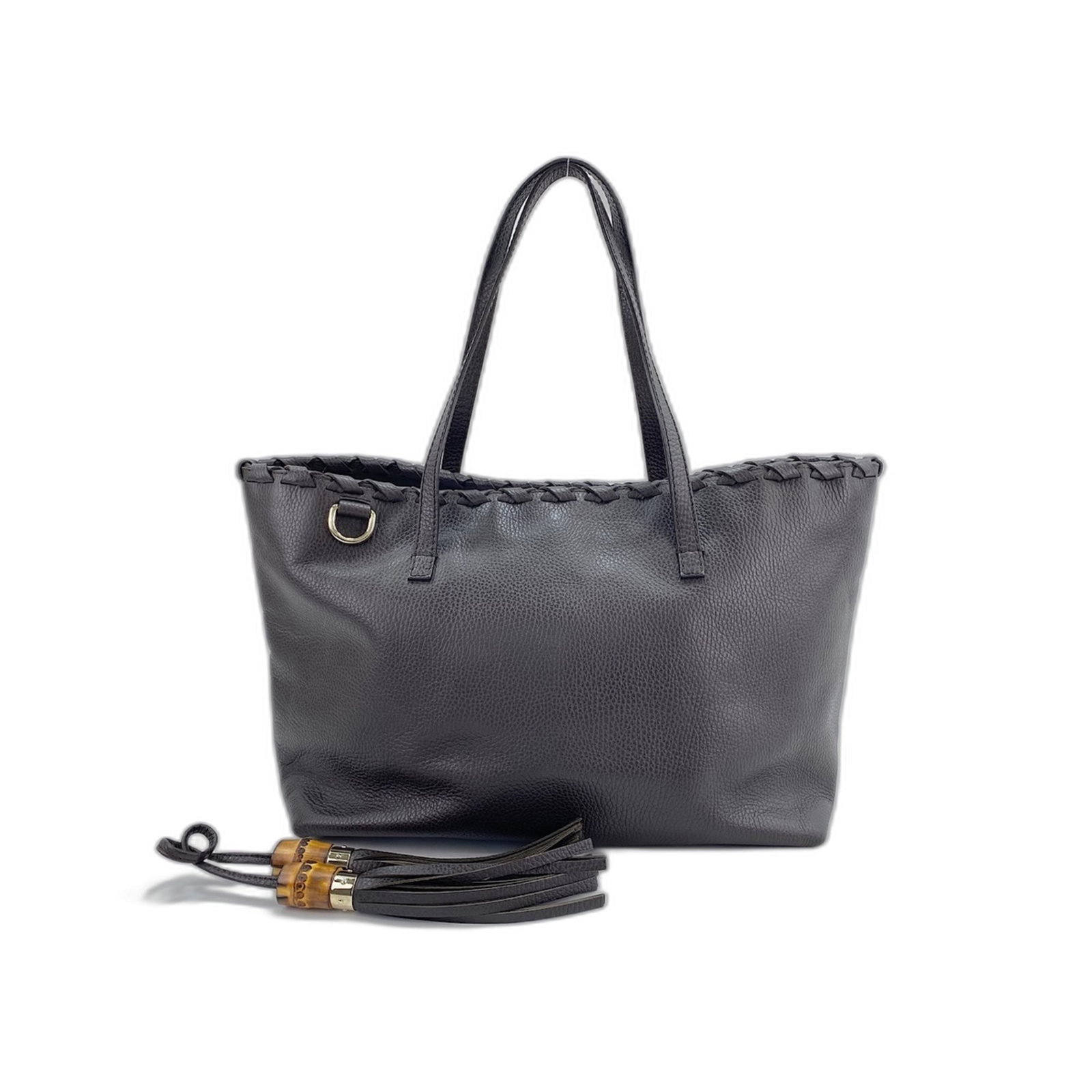 Bag Tote Gucci: Bag Tote Gucci Brown Gucci Tote Bag with Classic Design. This 25cm x 37cm x 15cm tote bag features a timeless brown color and a stylish handle drop of 21.00cm. The bag bears a signature, but its