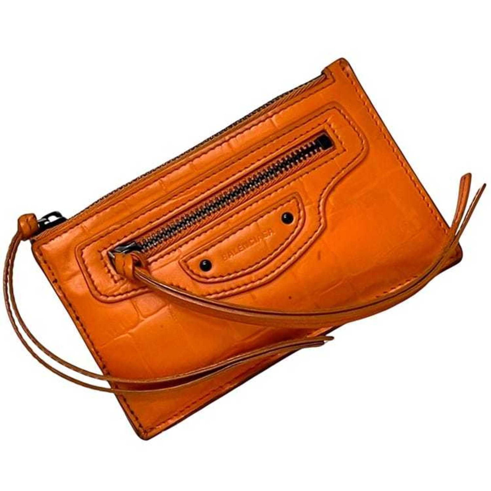 Balenciaga Coin Purse/ Coin Case Leather: Balenciaga Coin Purse/ Coin Case Leather Balenciaga Coin Purse/ Coin Case Leather is a vibrant orange leather coin purse with a sleek design. Made from high-quality leather, this compact accessory