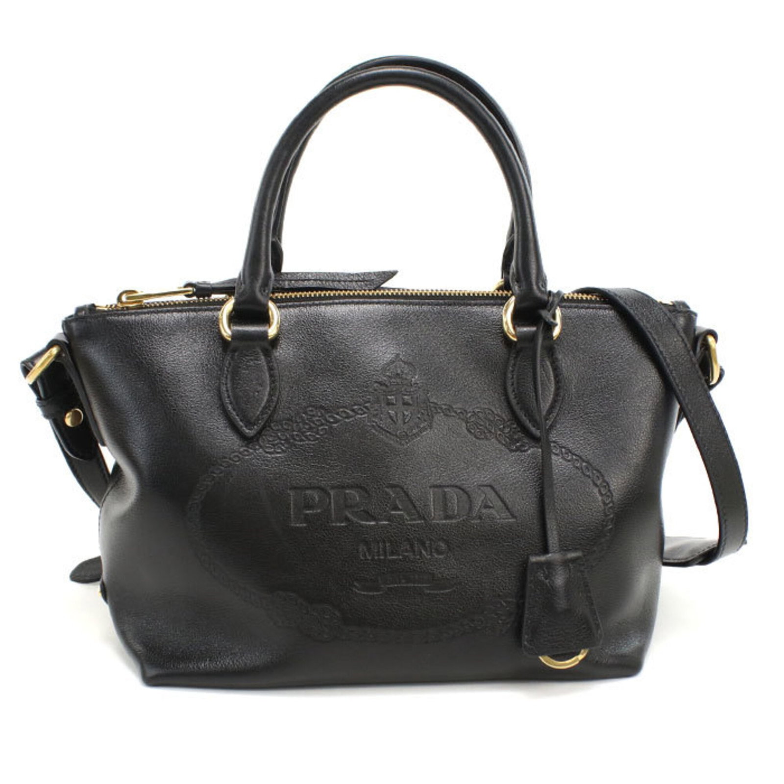 Handbag Leather Prada: Handbag Leather Prada This black leather handbag from Prada features gold hardware, showcasing a classic and sophisticated design. Made from high-quality leather, the bag measures 18cm x 23cm x 14cm a