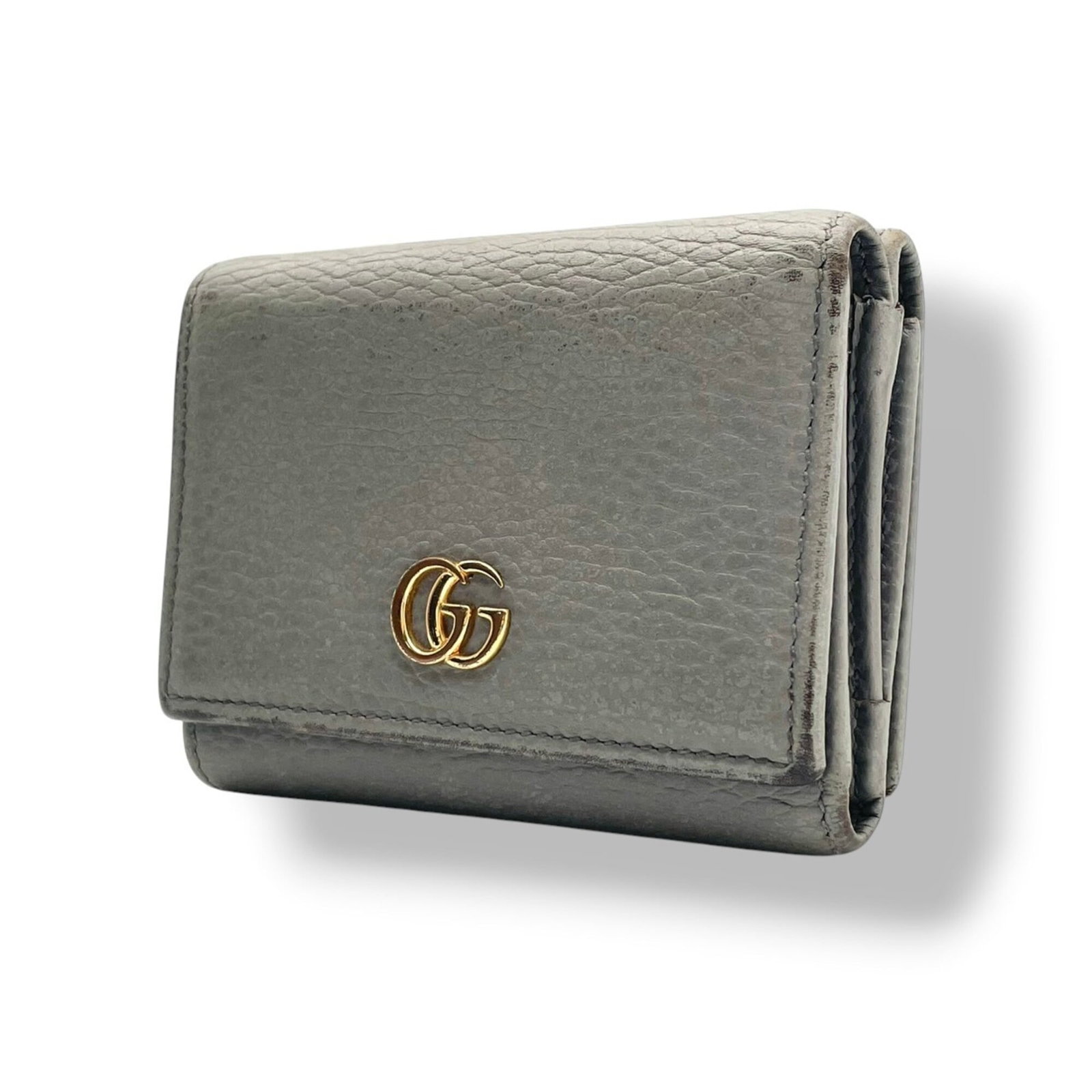 Gucci Wallet (Tri-Fold) Leather: Gucci Wallet (Tri-Fold) Leather Gucci's iconic tri-fold wallet is crafted from high-quality leather, featuring a sleek gray color that exudes timeless sophistication. Measuring 8.5cm x 11cm x 3cm,