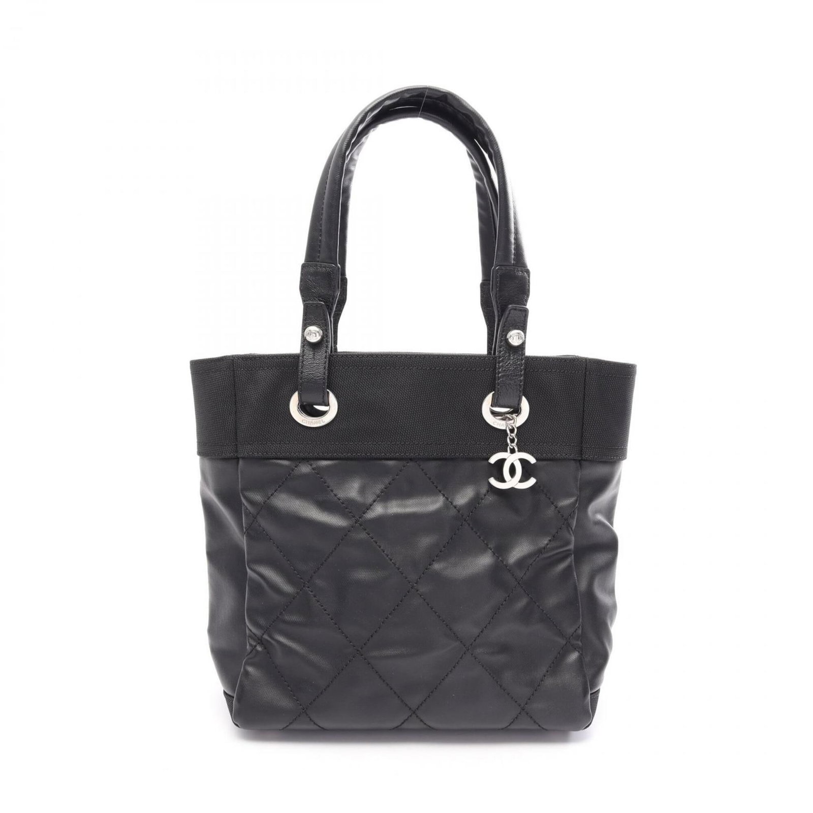 Canvas Leather Coated Chanel Tote Bag: Canvas Leather Coated Chanel Tote Bag Canvas Leather Coated Chanel Tote Bag in Black with Silver Hardware. This stylish tote bag features a unique combination of coated canvas and leather, offering a