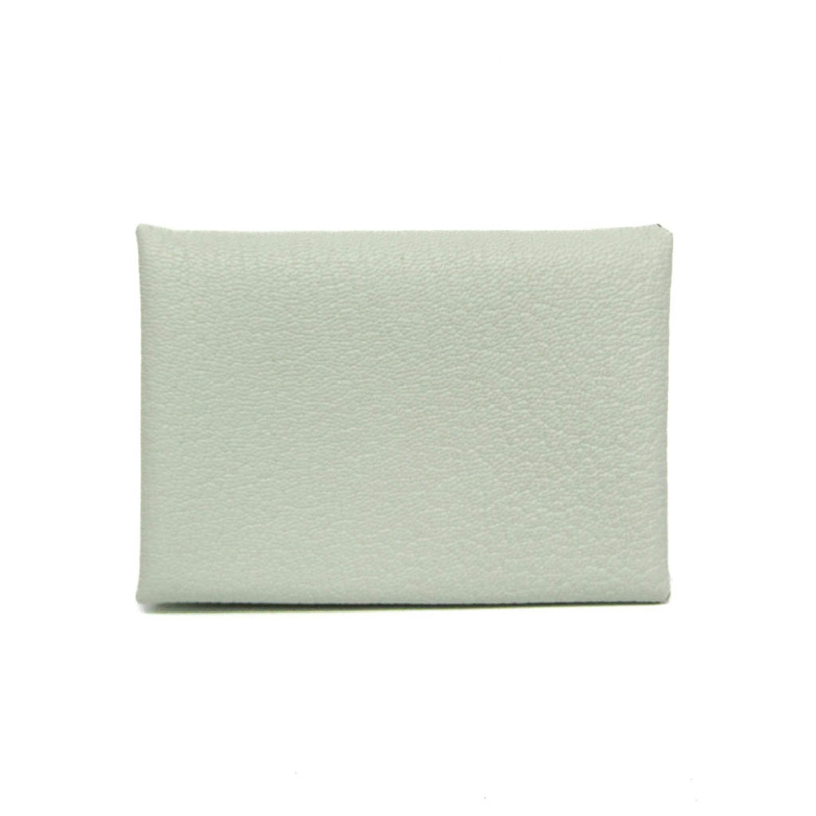 Chevre leather card case by Hermes: Chevre leather card case by Hermes Light green Chevre leather card case by Hermes, featuring a snap fastener closure and button pocket for added organization, measures 7.5cm x 10.5cm x 1.5cm. Made