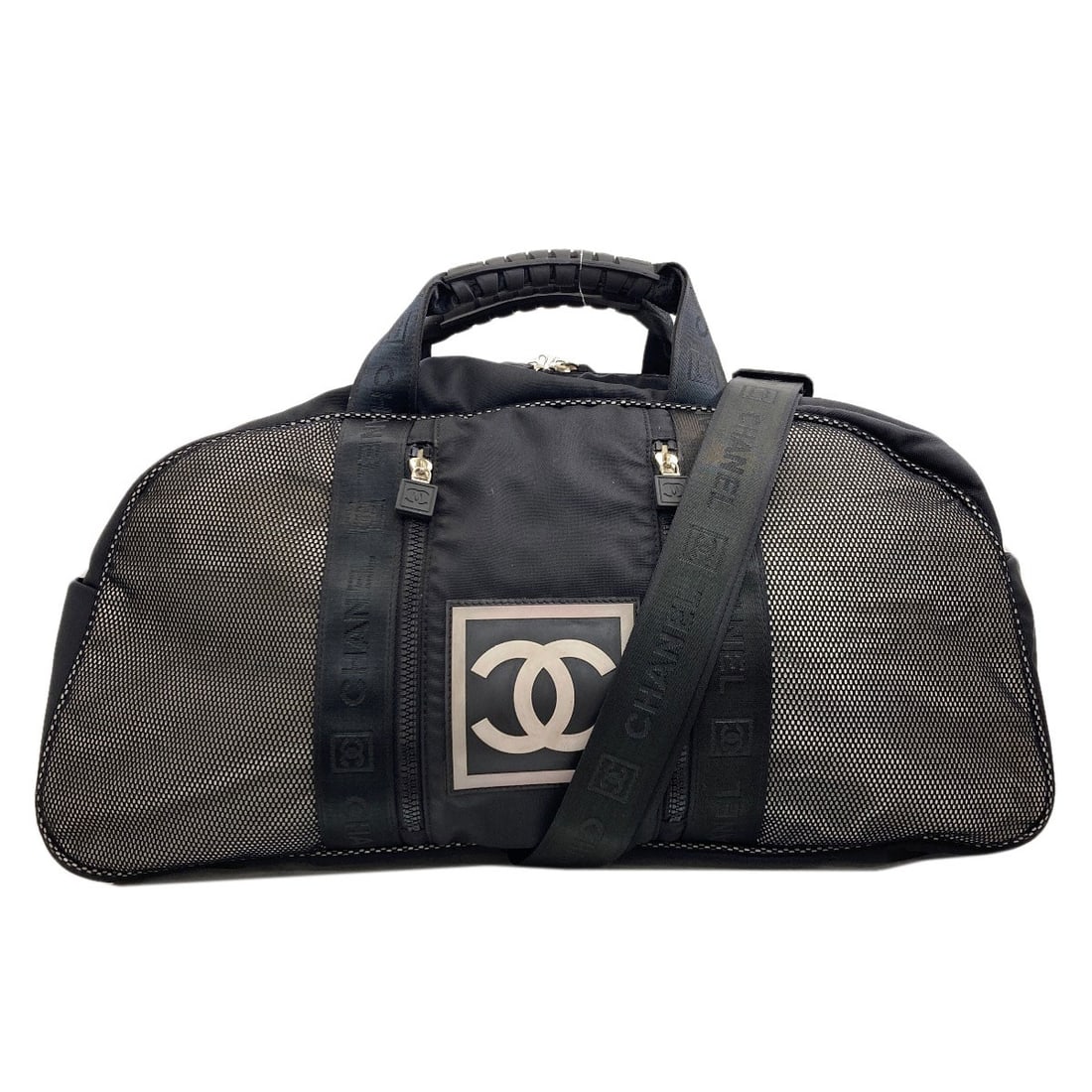 Boston Bag Nylon Sports Chanel: Boston Bag Nylon Sports Chanel Boston Bag Nylon Sports Chanel is a black nylon bag from the CHANEL brand, featuring a classic Boston bag style. Made from high-quality nylon, this bag boasts a sleek