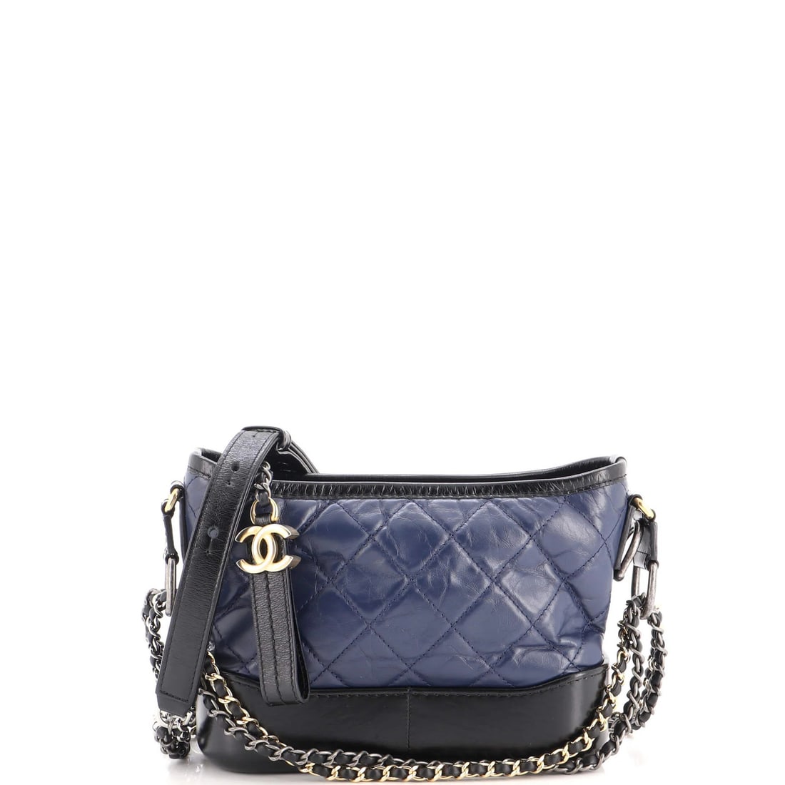 Calfskin Quilted Aged Small Hobo By Gabrielle Chanel: Calfskin Quilted Aged Small Hobo By Gabrielle Chanel Small, quilted, and aged to perfection, this navy blue Gabrielle Chanel hobo features a classic design with minor scuffs and creases on the