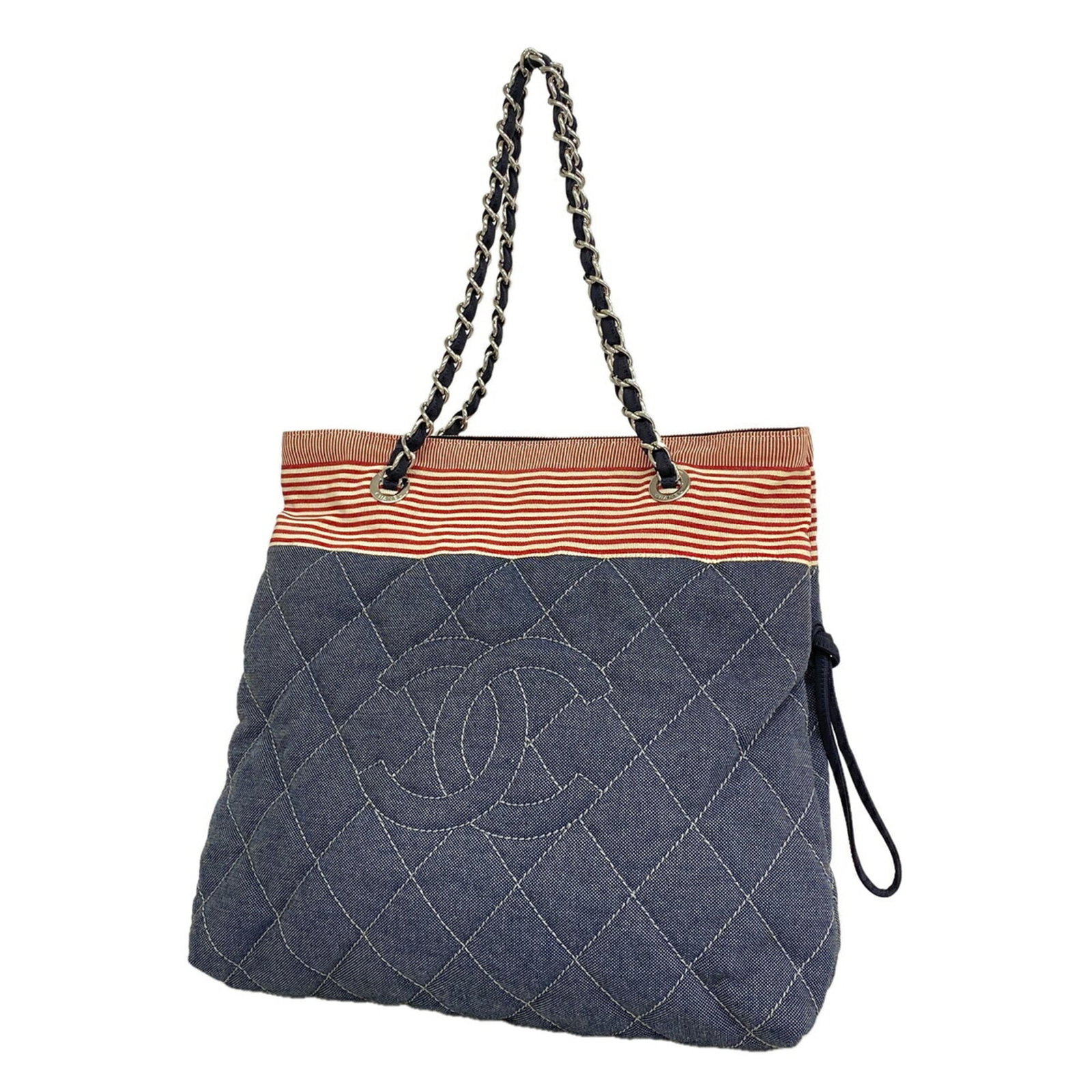 Canvas tote bag by Chanel: Canvas tote bag by Chanel Navy canvas tote bag with silver hardware, a classic cruise-style design from renowned fashion brand Chanel. Measuring 35cm x 35cm x 9.5cm, this stylish bag features a