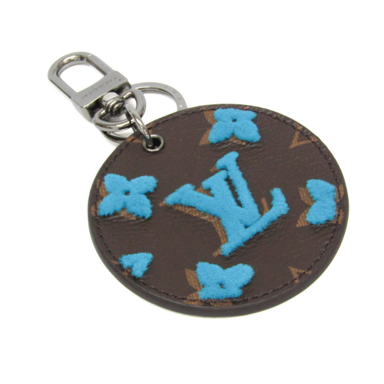 Monogram Keyring Louis Vuitton: Monogram Keyring Louis Vuitton Monogram Keyring Louis Vuitton features a distinctive blue and brown monogram pattern, characteristic of the iconic Louis Vuitton brand. Made from high-quality materials