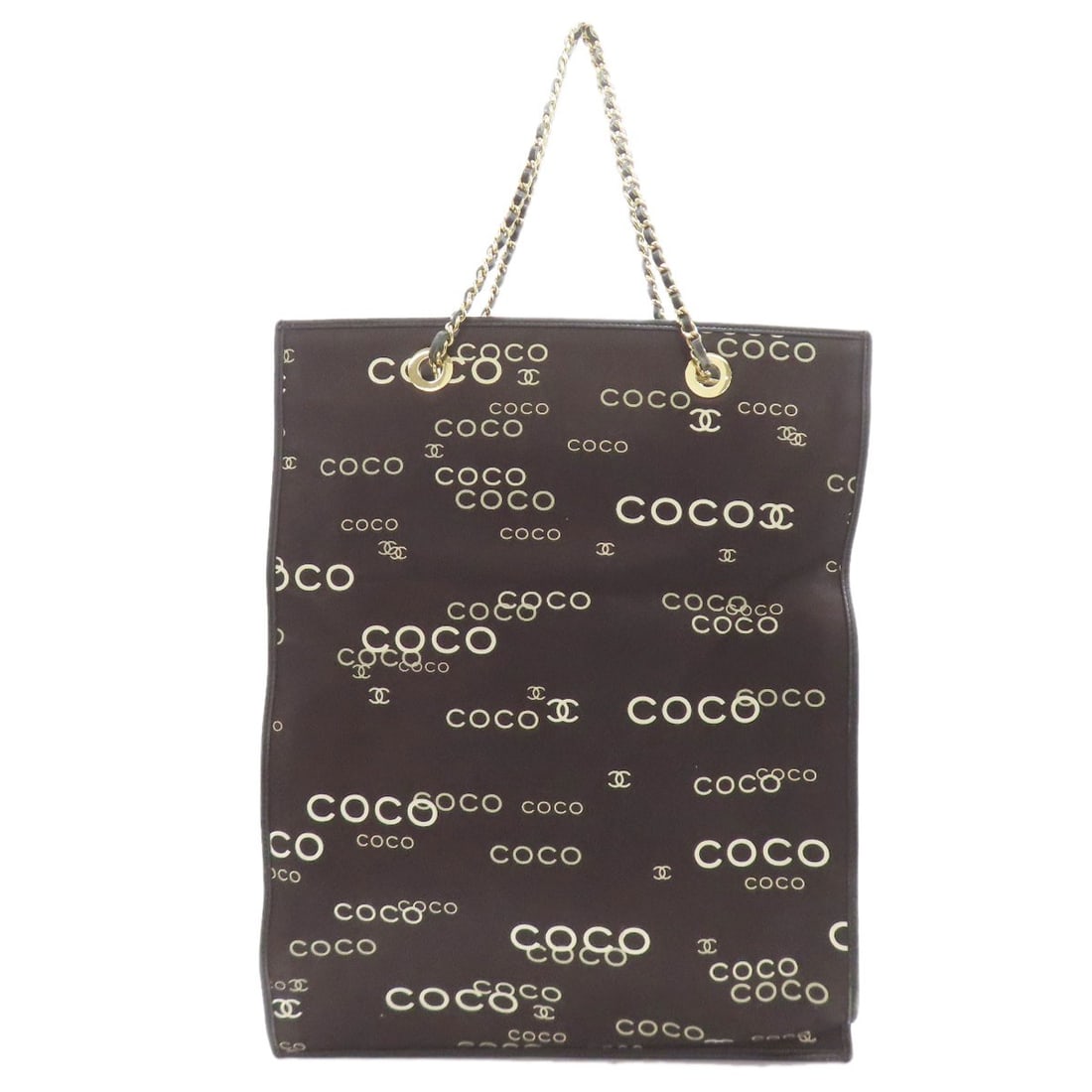 Chanel Coco Print Goldhardware Tote Bag Canvas: Chanel Coco Print Goldhardware Tote Bag Canvas Black canvas tote bag with gold hardware from CHANEL, featuring the iconic Coco print. This stylish tote boasts a sleek and sophisticated design,