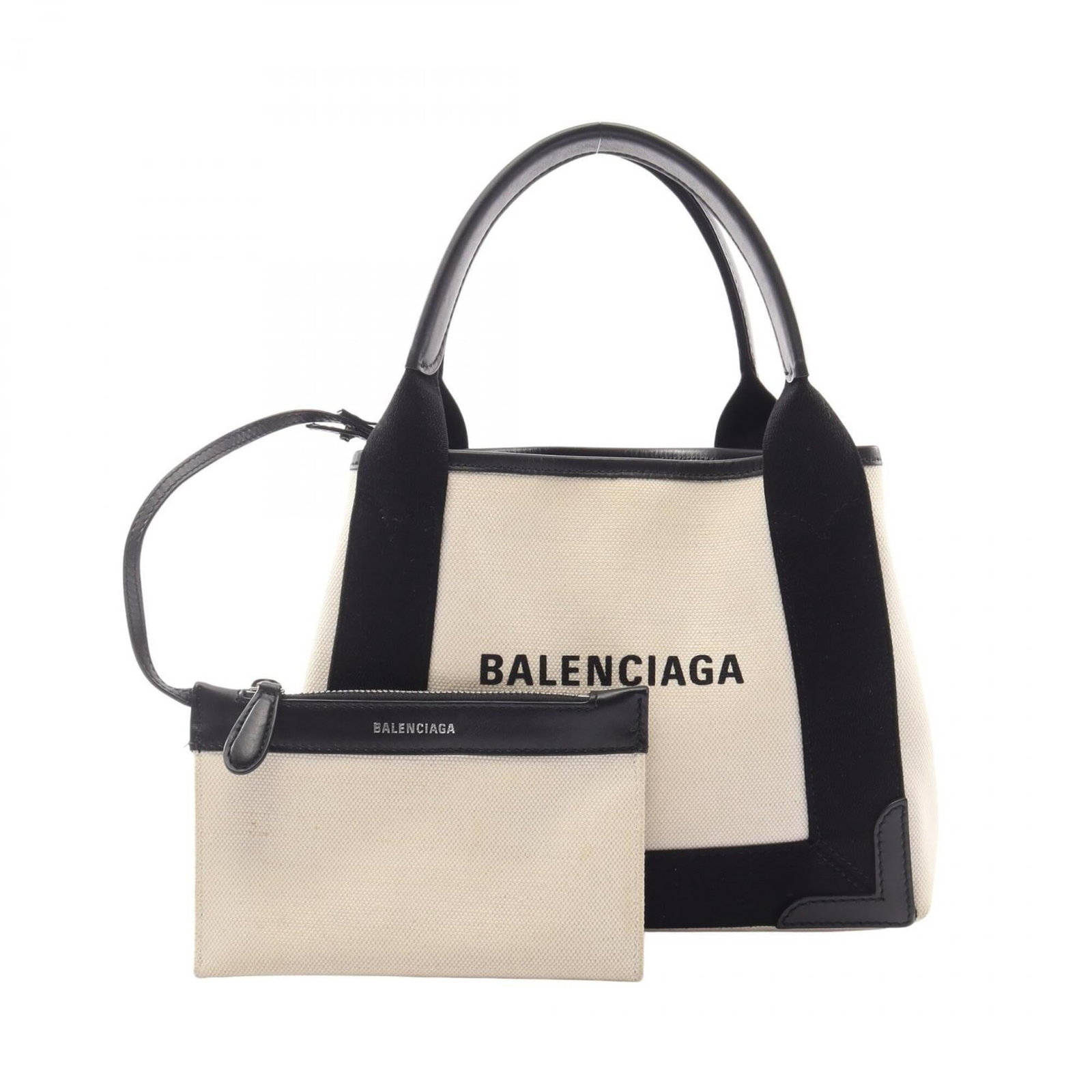 Canvas leather handbag by Balenciaga: Canvas leather handbag by Balenciaga Canvas leather handbag by Balenciaga, featuring a unique blend of canvas and leather materials in a sleek black and white design. Measuring 20cm x 25cm x 7cm,