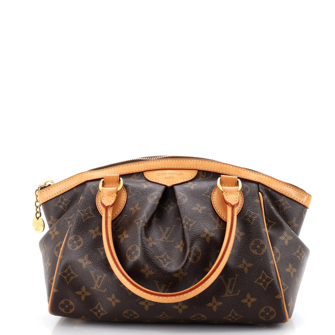 Louis Vuitton Tivoli Monogram Canvas Handbag: Louis Vuitton Tivoli Monogram Canvas Handbag Brown Louis Vuitton Tivoli Monogram Canvas Satchel. This PM size handbag features a classic canvas exterior with discoloration, corner wear, and minor crea