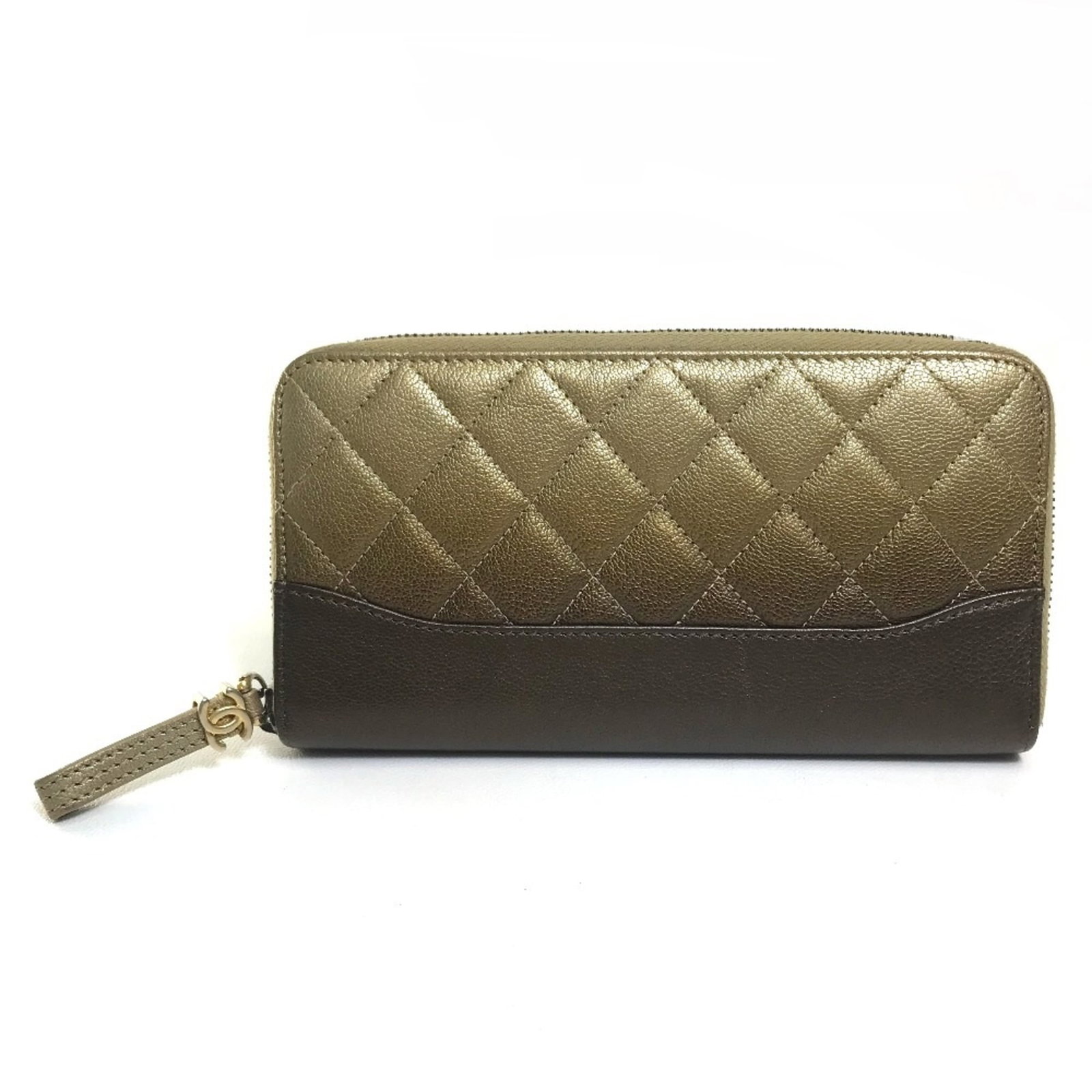 Chanel Long Wallet (Bi-Fold) Leather: Chanel Long Wallet (Bi-Fold) Leather The Chanel Long Wallet (Bi-Fold) Leather boasts a sleek, gold finish and measures 19cm x 10.5cm. This bi-fold wallet features a sturdy leather material and a