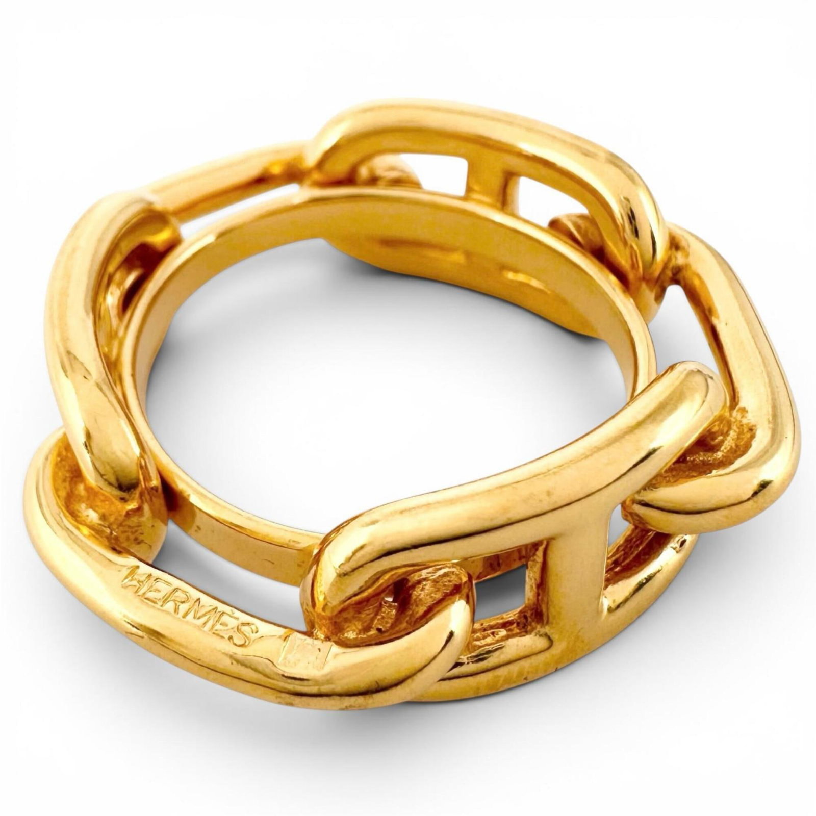 Hermes Ring Scarf: Hermes Ring Scarf The Hermes Ring Scarf is a gold scarf ring featuring the iconic brand. This scarf ring showcases the brand's signature style with its gold color. Item Specifics: Brand: Hermes Type: 