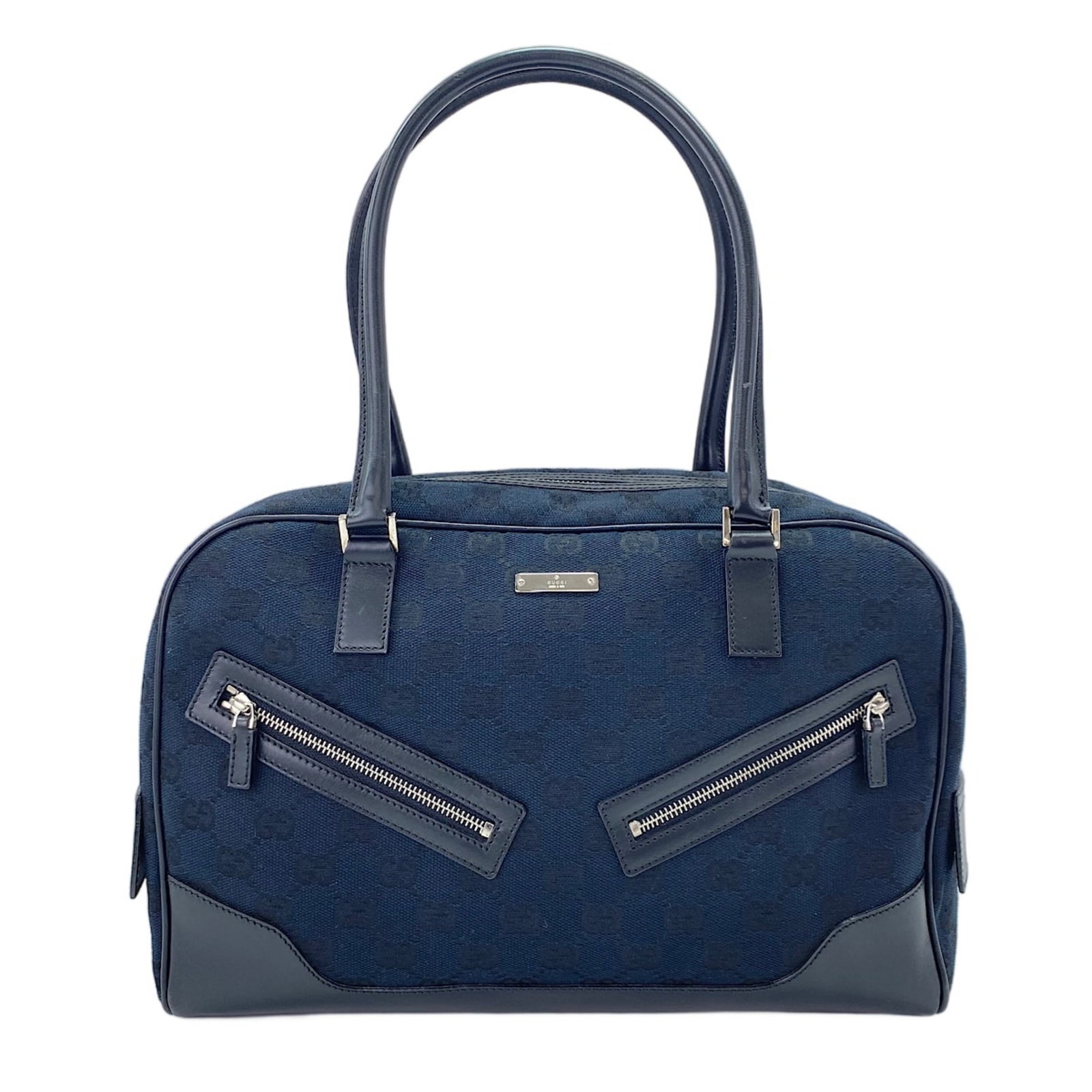 Handbag: Handbag Navy Gucci Handbag, 22cm x 30cm x 10cm, features a classic design with a 17cm drop handle. The handbag bears a signature, but its authenticity cannot be verified. This navy-colored Gucci
