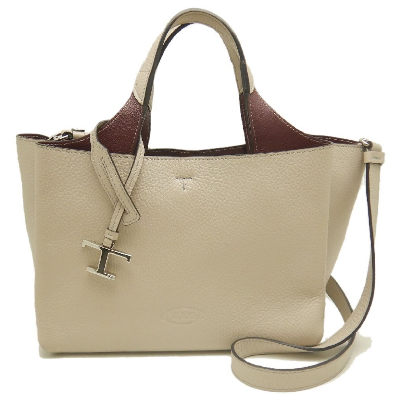 Handbag Leather Tod'S: Handbag Leather Tod'S The Tod's Handbag is a high-quality leather handbag with a cream color and dimensions of 19.5cm x 29cm x 18cm. This Tod's handbag features a classic design and is made from