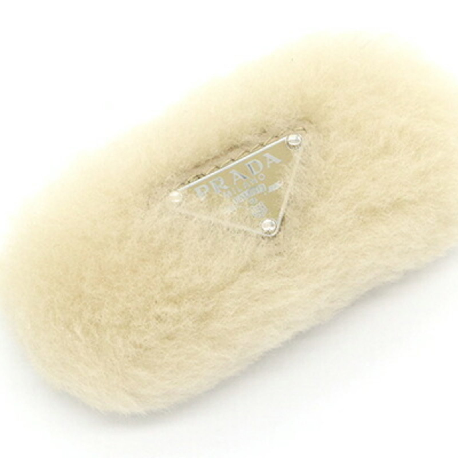 Prada Barrette Leather: Prada Barrette Leather The Prada Barrette Leather is a stylish accessory made from high-quality leather, featuring a distinctive mouton design. Measuring 4.3cm x 8.5cm, this elegant barrette is crafte