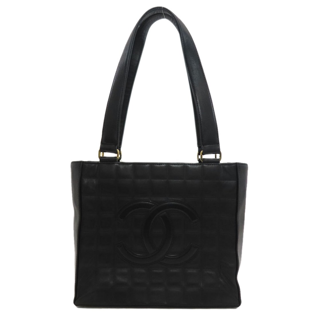 Chanel Chocolate Bar Coco Mark Goldhardware Tote Bag Lambskin: Chanel Chocolate Bar Coco Mark Goldhardware Tote Bag Lambskin Lambskin exterior and gold hardware accentuate this sleek black Chanel tote bag, measuring 8.3 inches in height and 9.6 inches in width. T